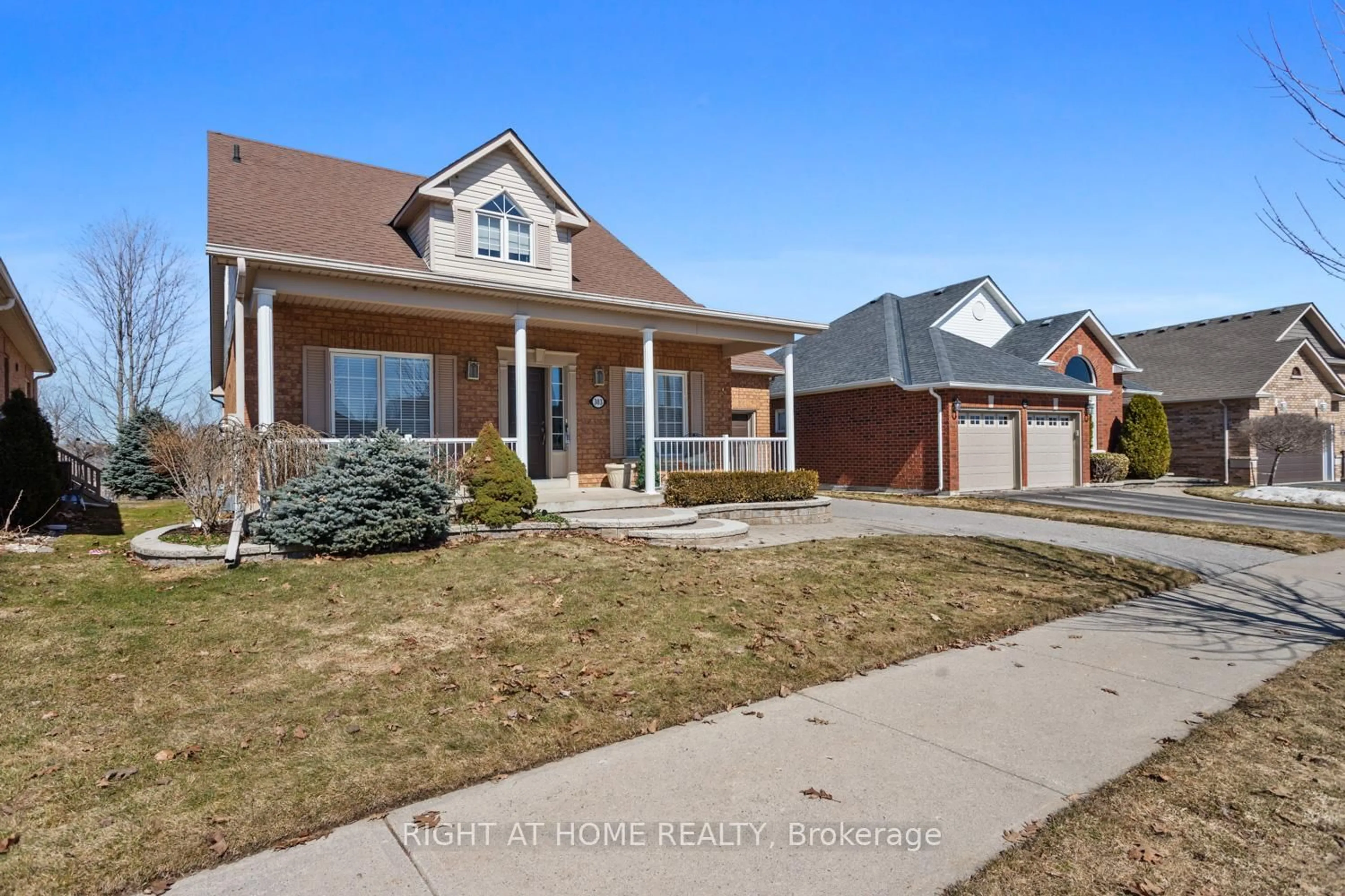 Home with brick exterior material, street for 303 WATERBURY Cres, Scugog Ontario L9L 1S5