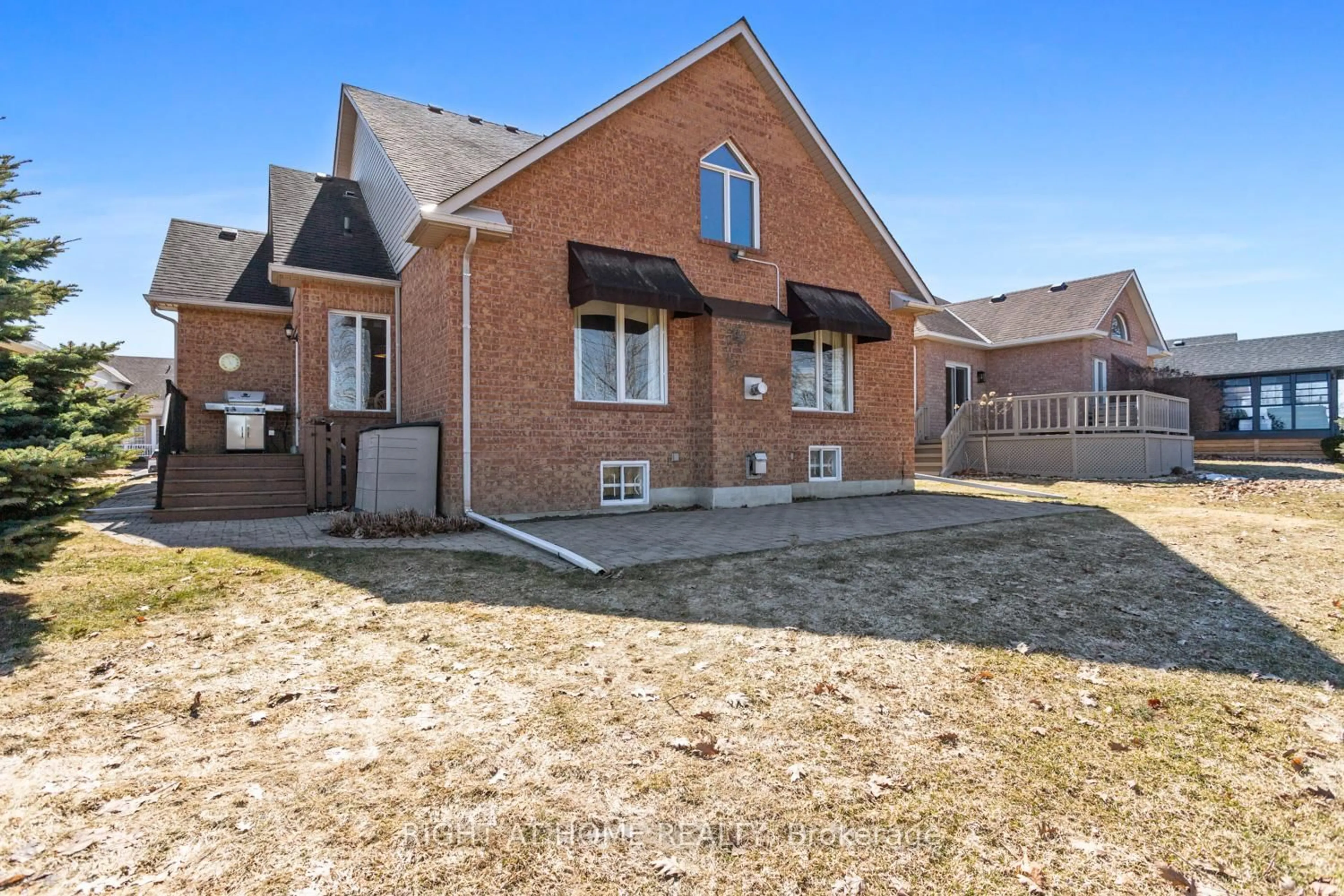 Home with brick exterior material, street for 303 WATERBURY Cres, Scugog Ontario L9L 1S5