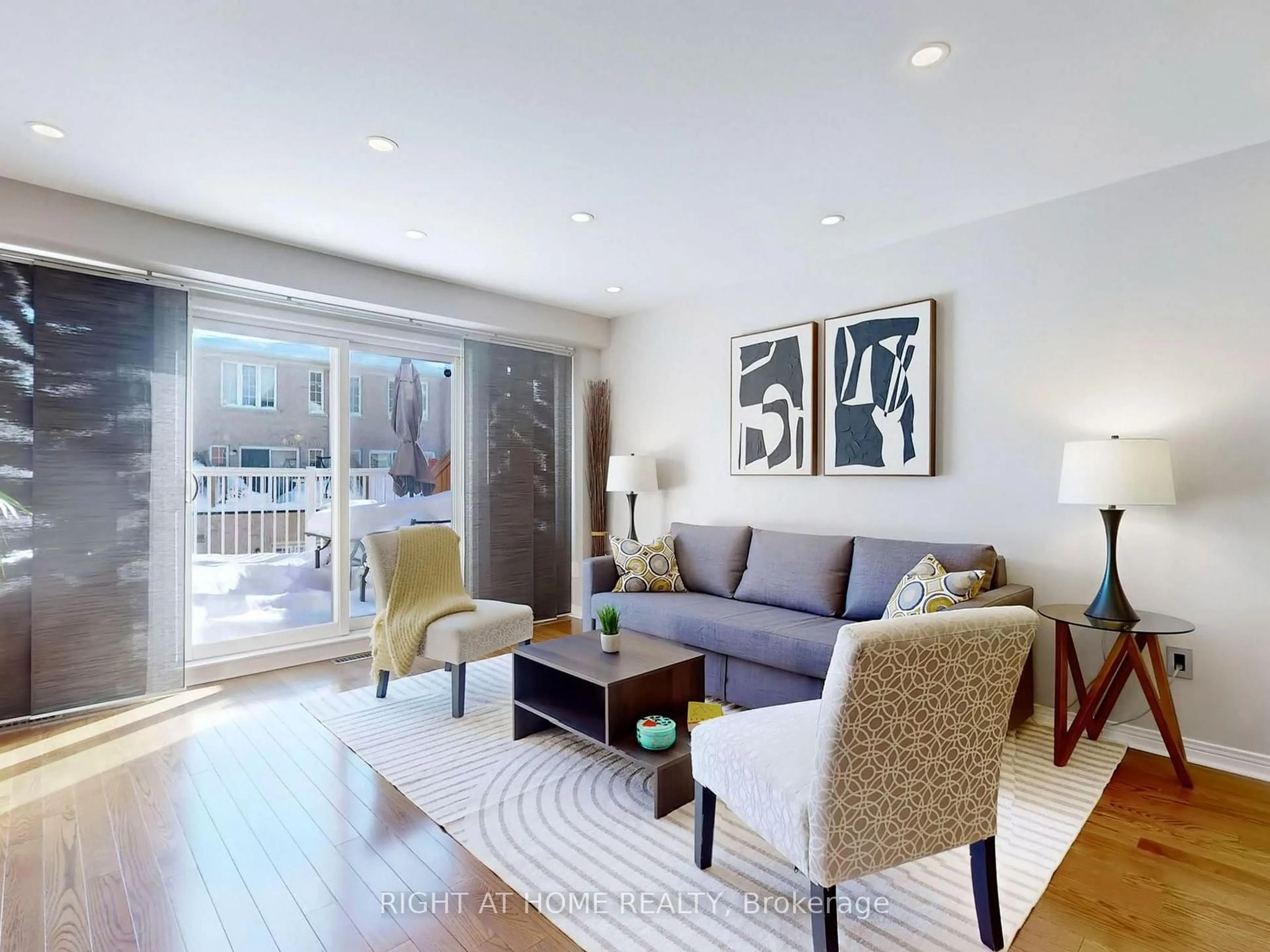 Living room with furniture, wood/laminate floor for 49 Wilkes Cres, Toronto Ontario M1L 0B4