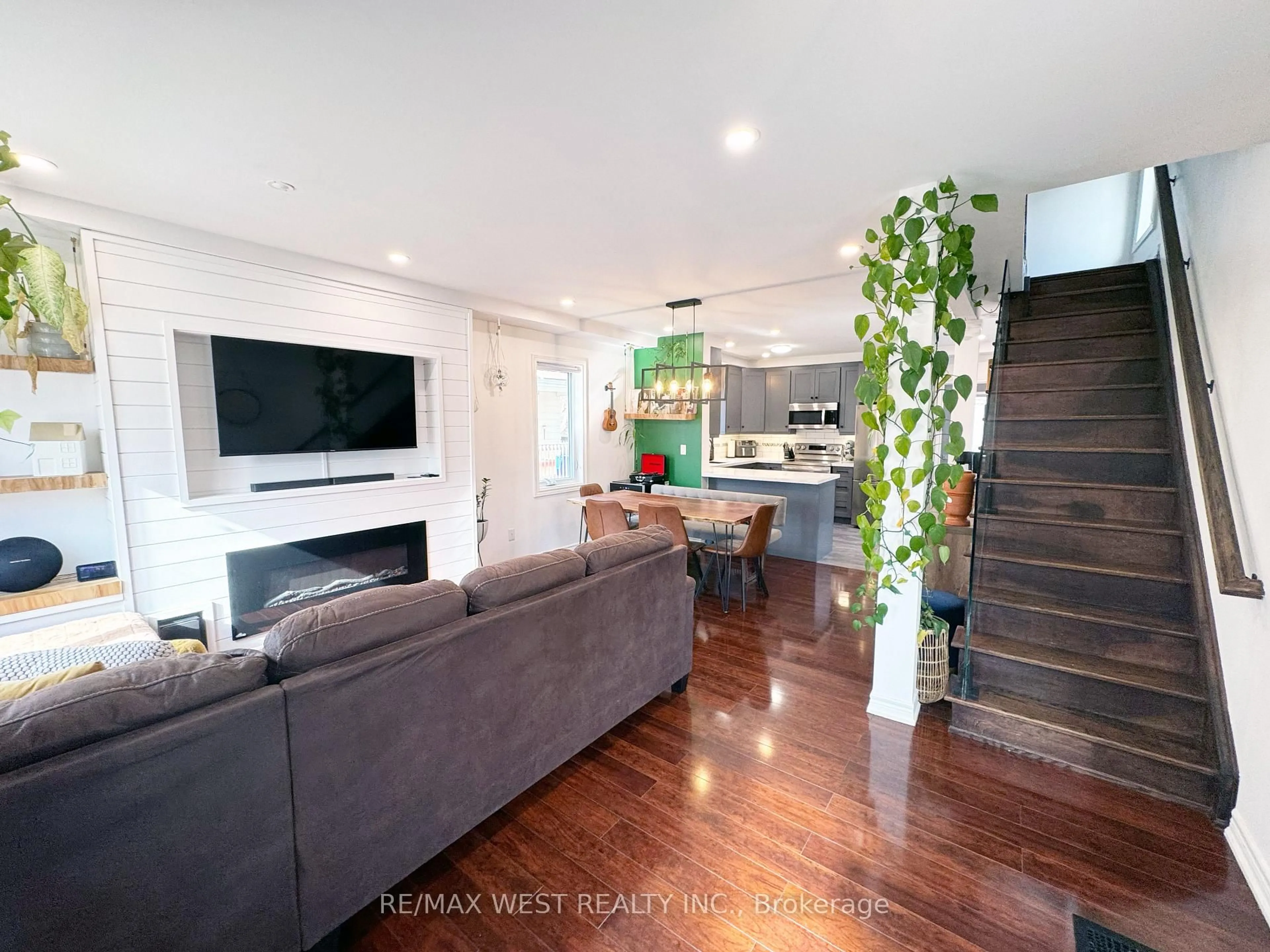 Living room with furniture, wood/laminate floor for 203 Court St, Oshawa Ontario L1H 4W6