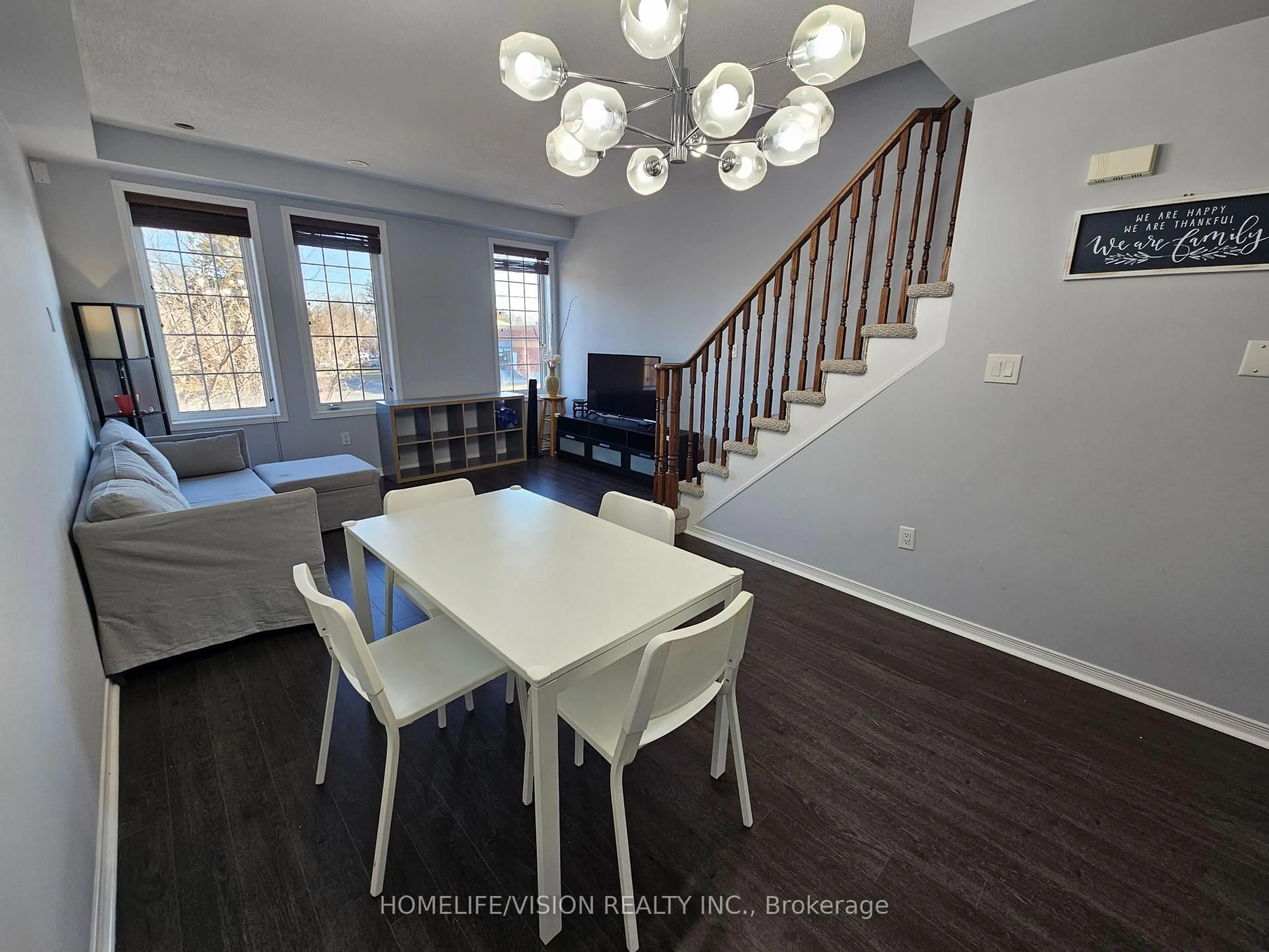 Living room with furniture, wood/laminate floor for 397 Beechgrove Dr #68, Toronto Ontario M1E 2R1
