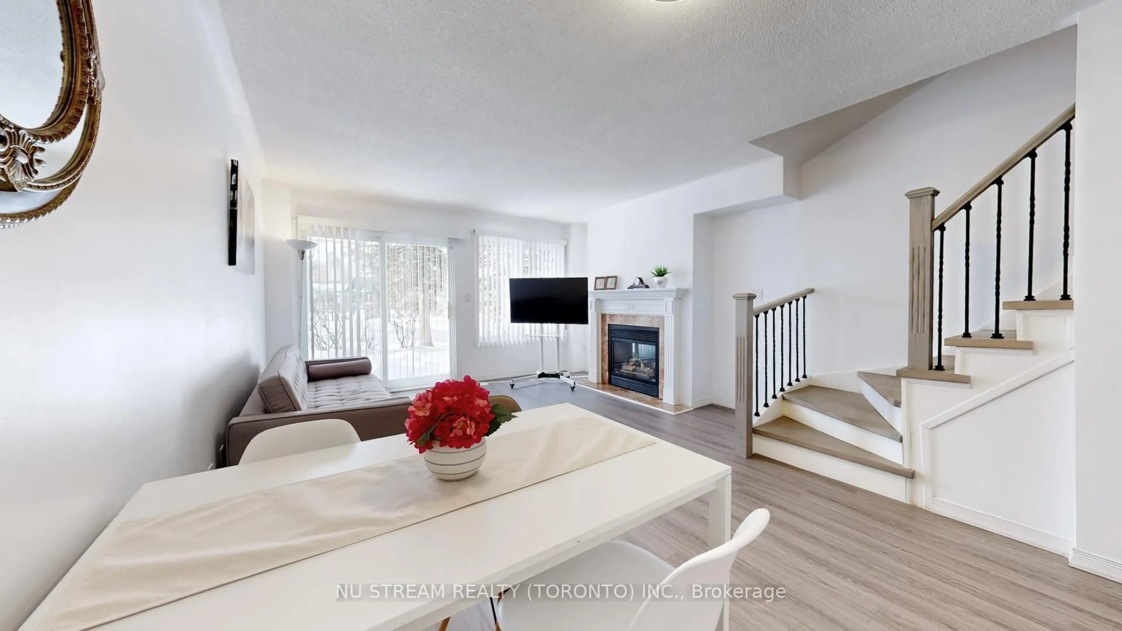 Living room with furniture, wood/laminate floor for 29 Rosebank Dr #907, Toronto Ontario M1B 5Y7