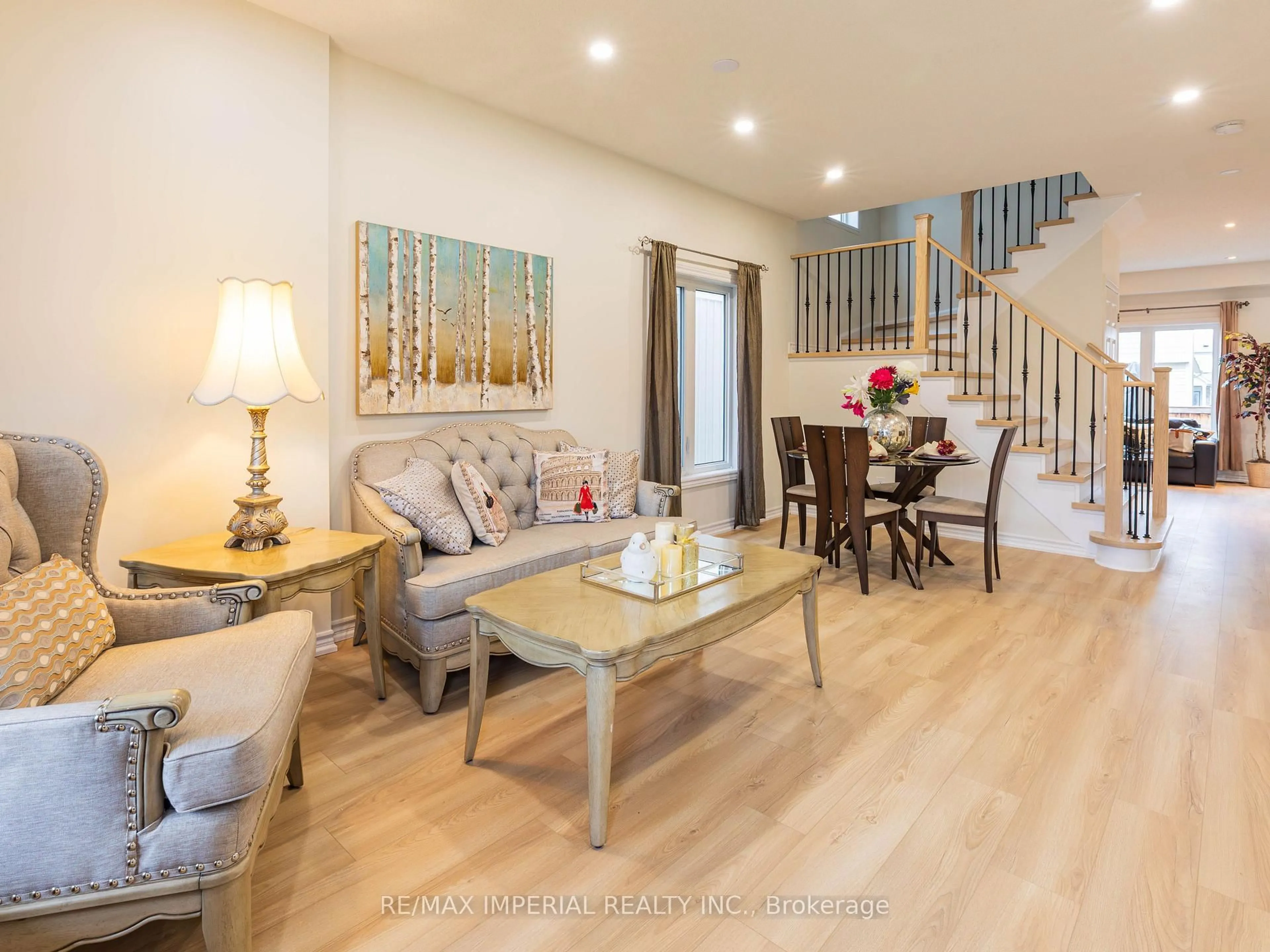 Living room with furniture, wood/laminate floor for 10 Sandgate St, Whitby Ontario L1R 0L3