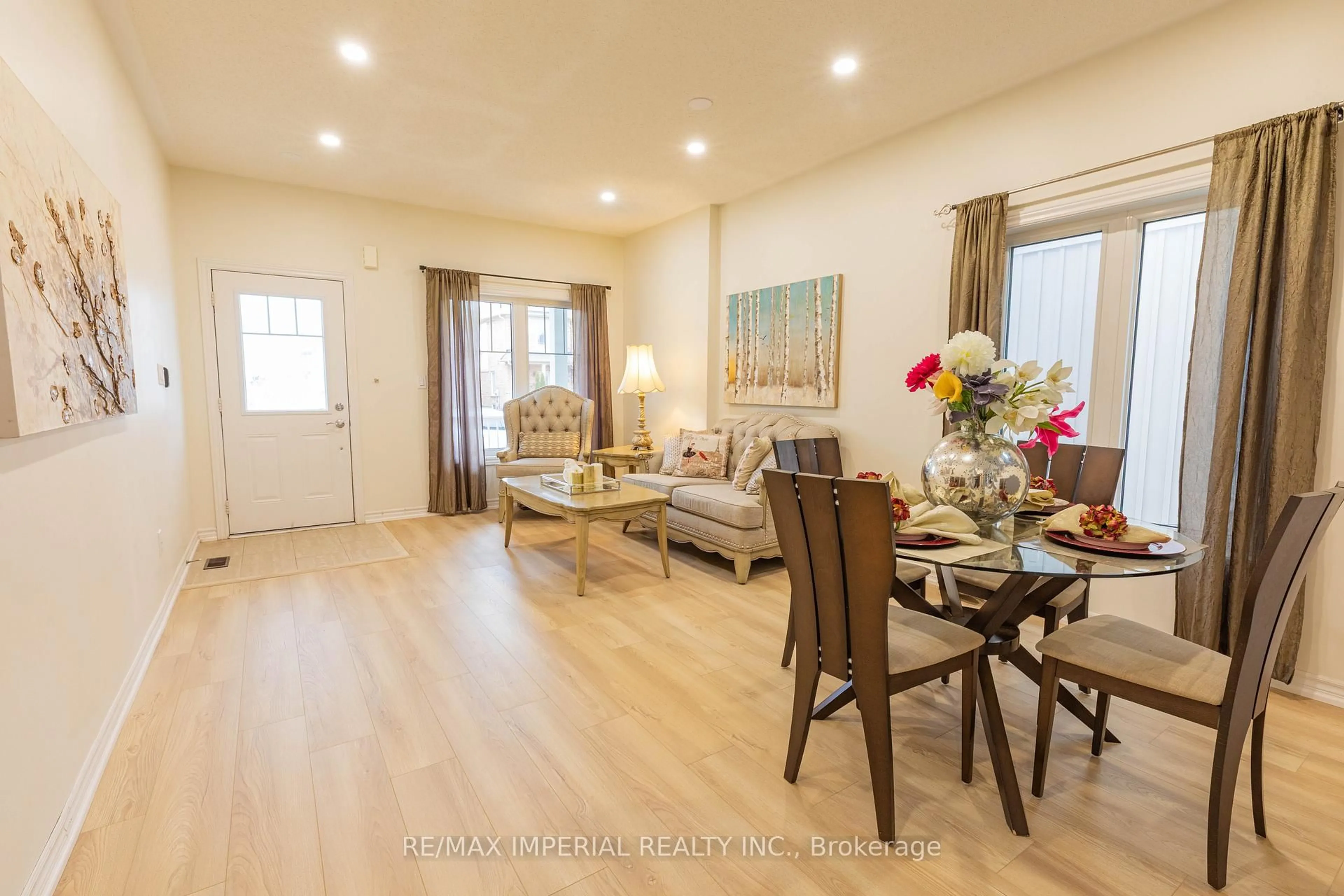 Living room with furniture, wood/laminate floor for 10 Sandgate St, Whitby Ontario L1R 0L3