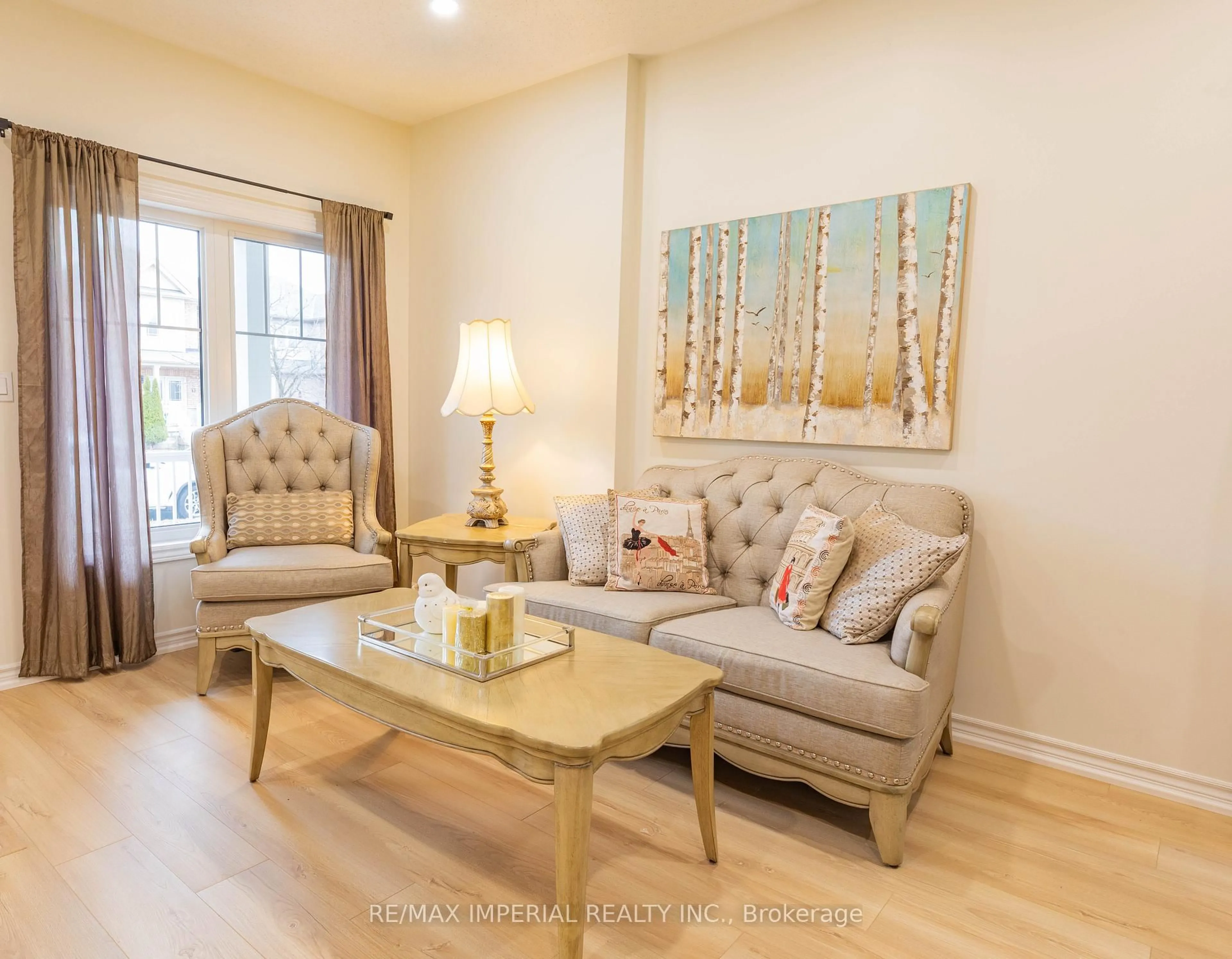 Living room with furniture, wood/laminate floor for 10 Sandgate St, Whitby Ontario L1R 0L3