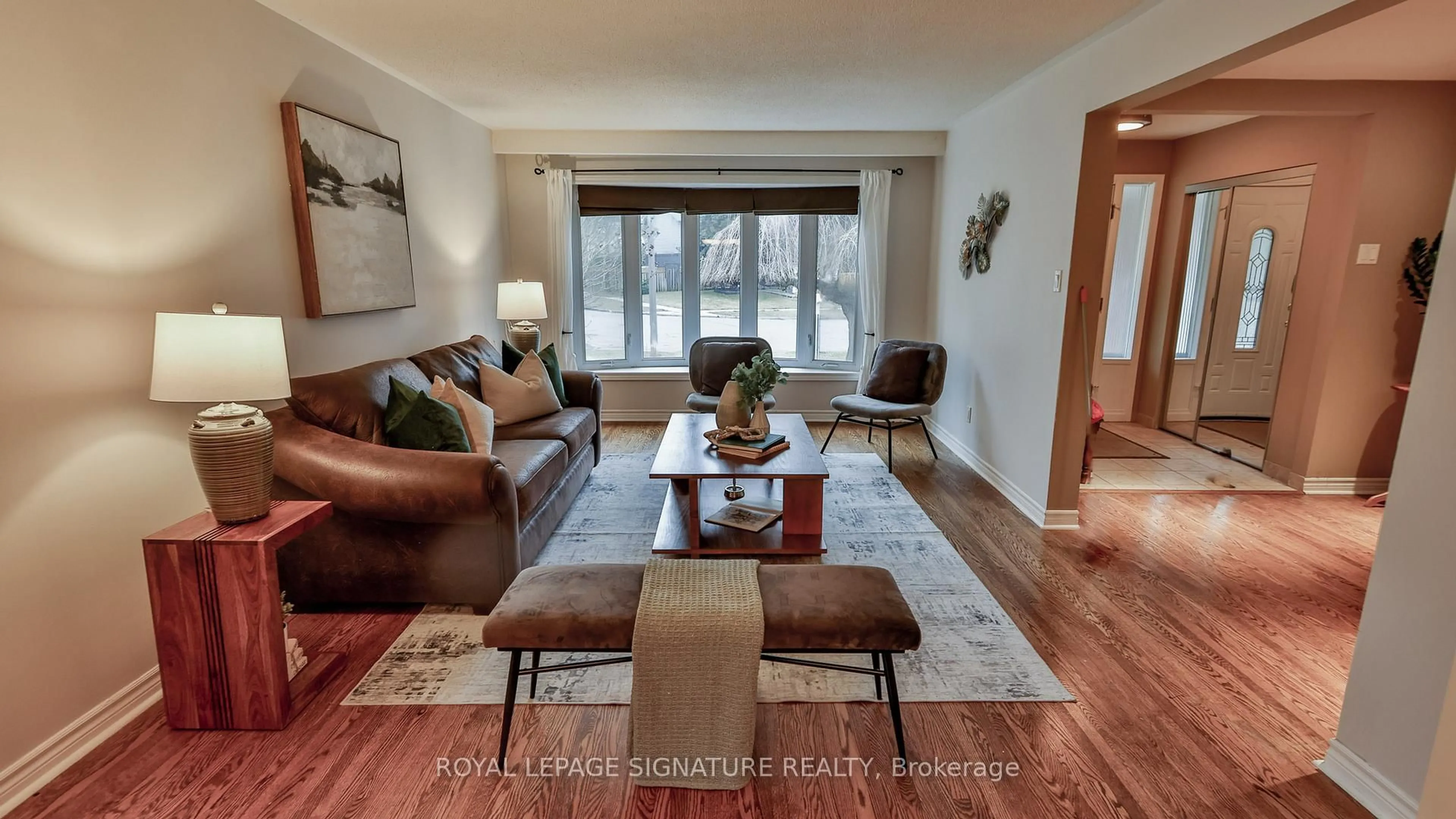 Living room with furniture, wood/laminate floor for 56 Satchell Blvd, Toronto Ontario M1C 3B4
