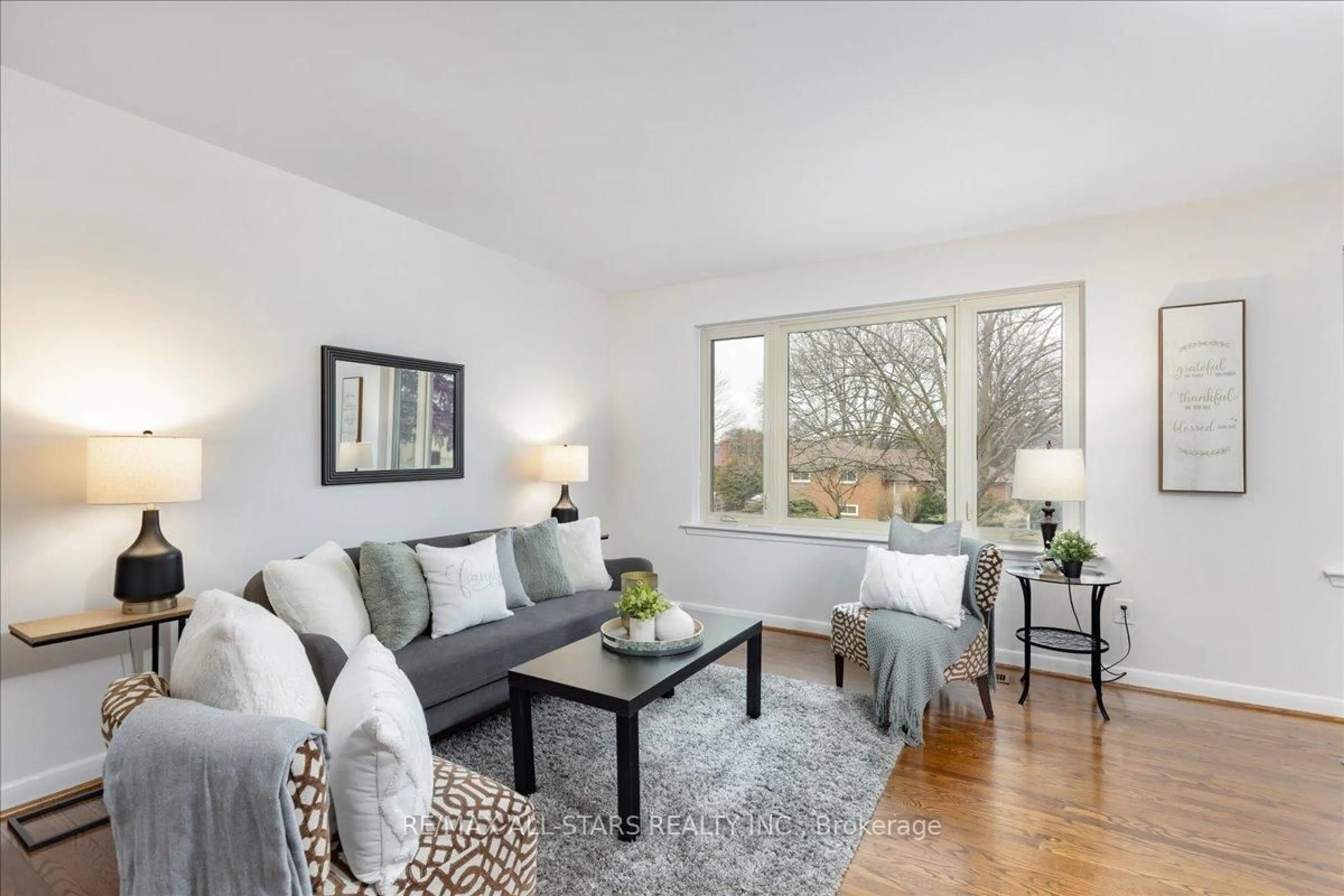 Living room with furniture, wood/laminate floor for 55 Sancrest Dr, Toronto Ontario M1P 4A7