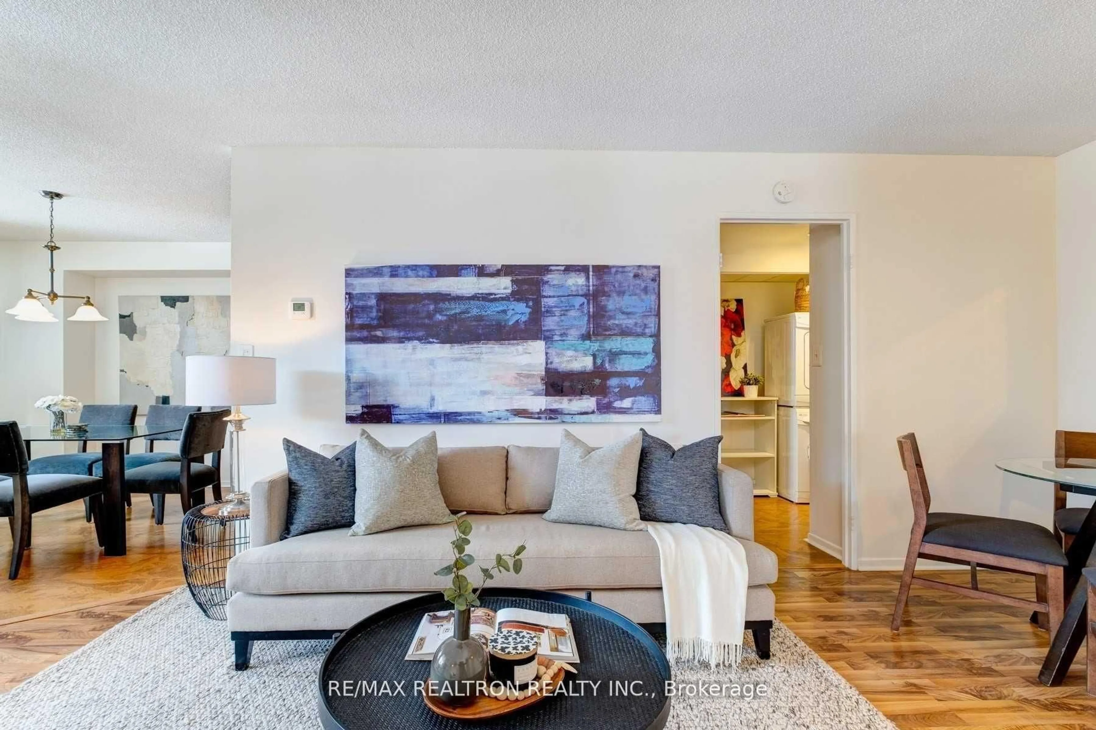 Living room with furniture, unknown for 90 Ling Rd #404, Toronto Ontario M1E 4Y3