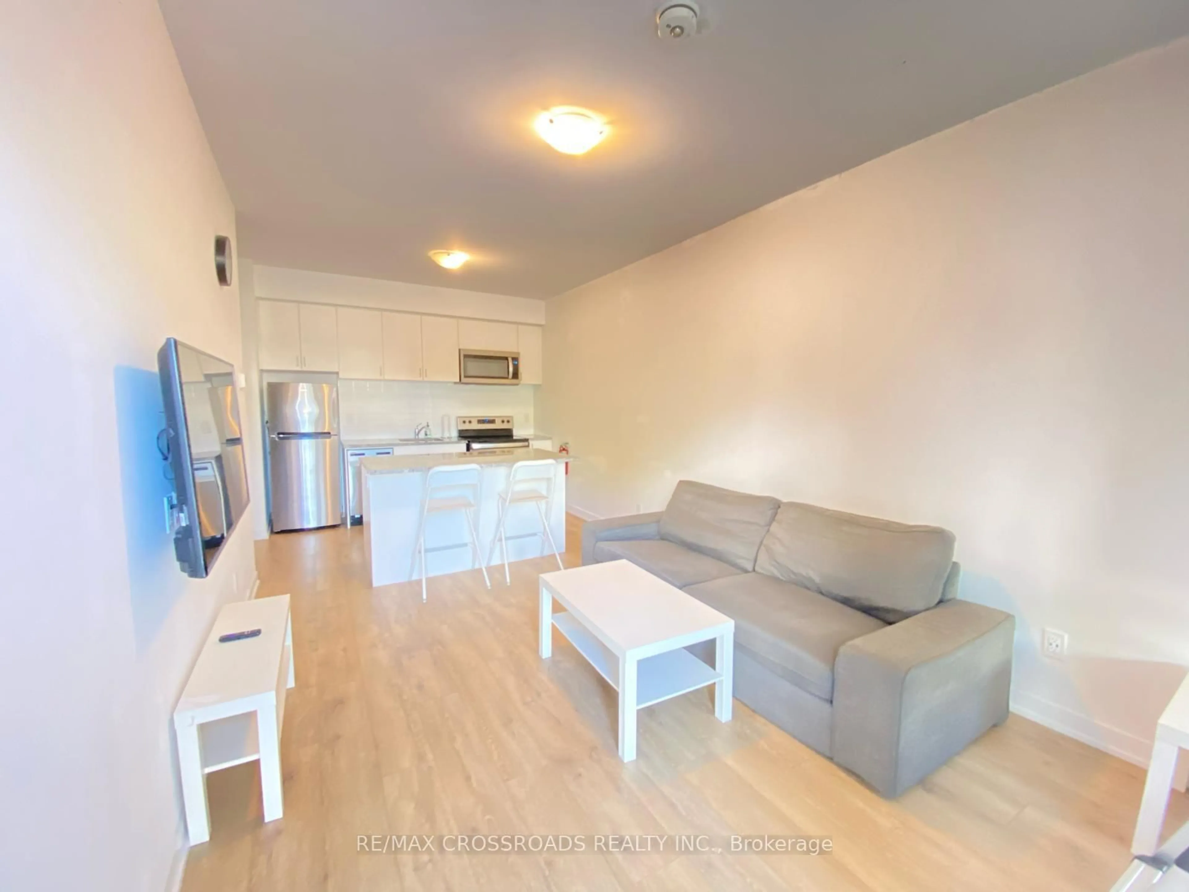 Living room with furniture, wood/laminate floor for 1720 Simcoe St #15, Oshawa Ontario L1G 4X9