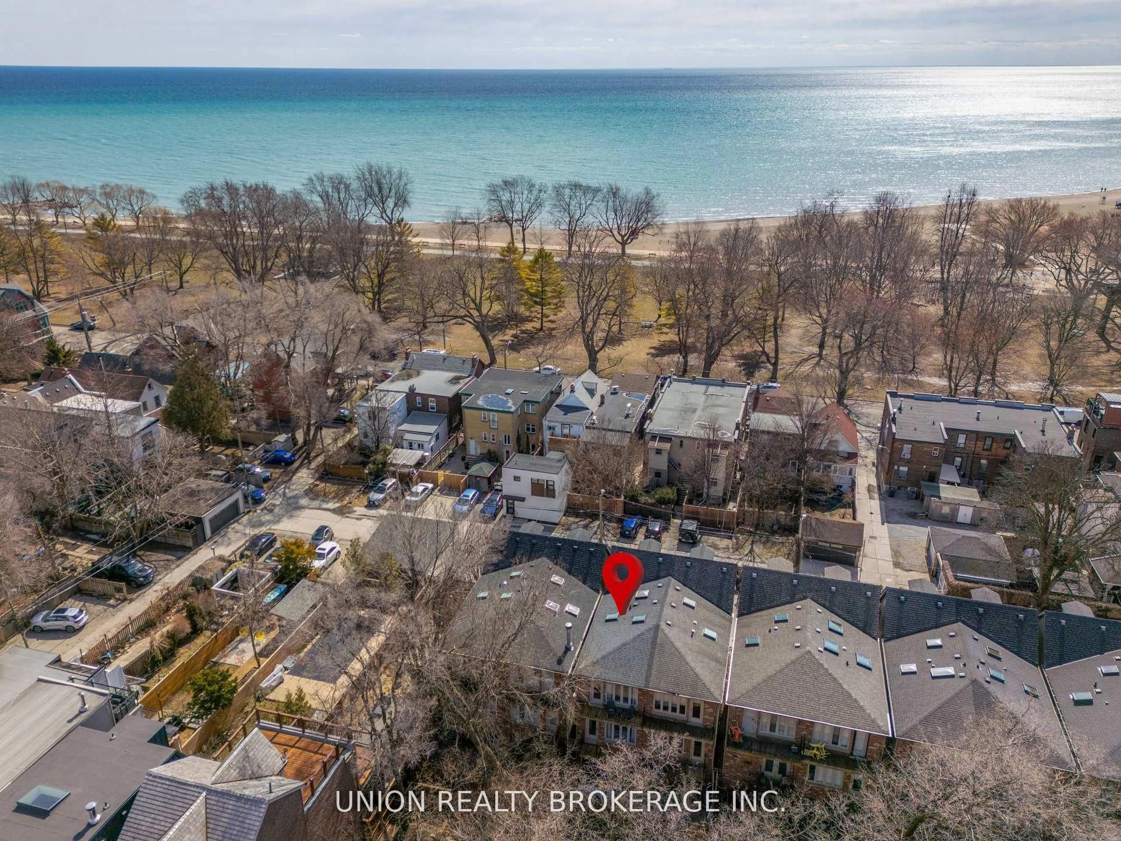 A pic from outside/outdoor area/front of a property/back of a property/a pic from drone, water/lake/river/ocean view for 59D Woodbine Ave, Toronto Ontario M4L 3P1