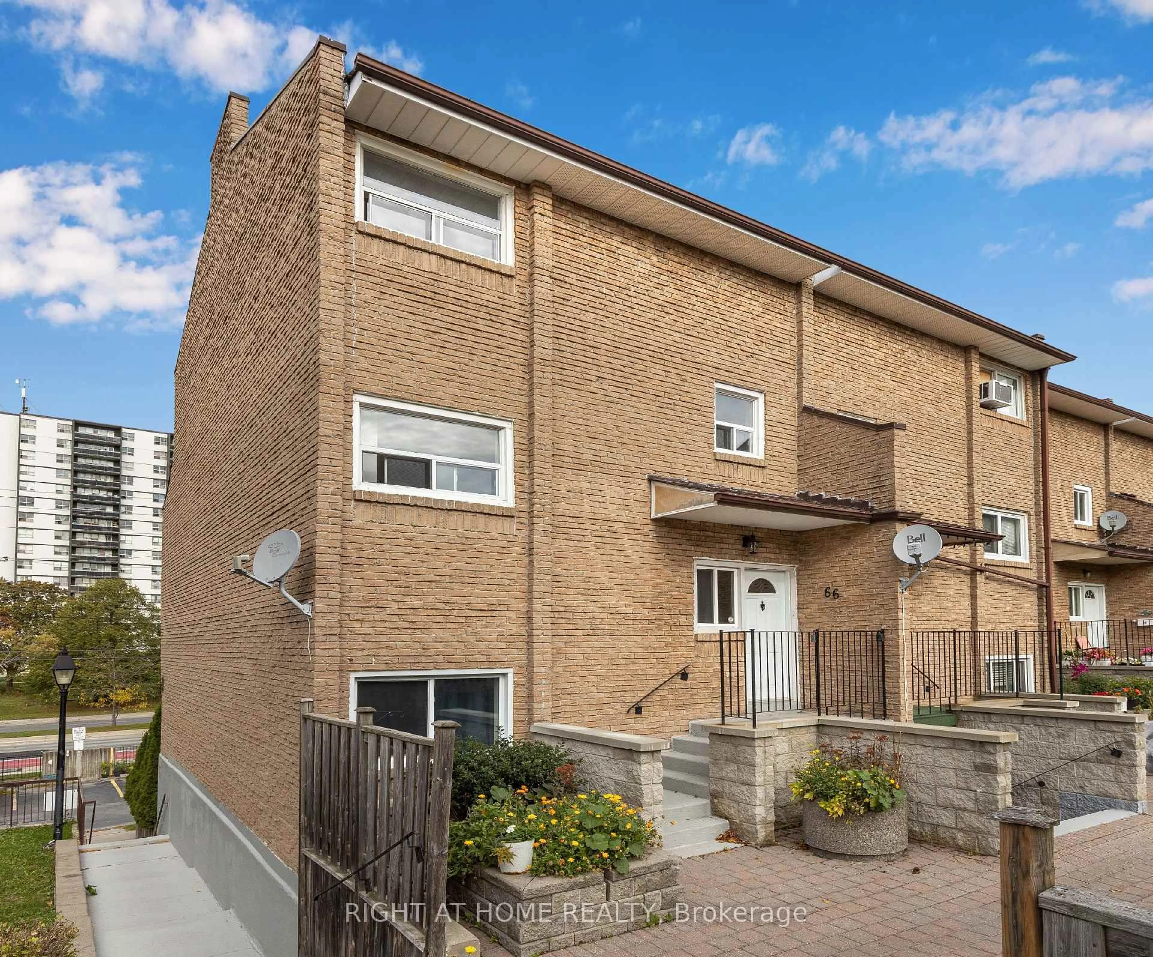 Home with brick exterior material, street for 91 Muir Dr #66, Toronto Ontario M1M 3T7