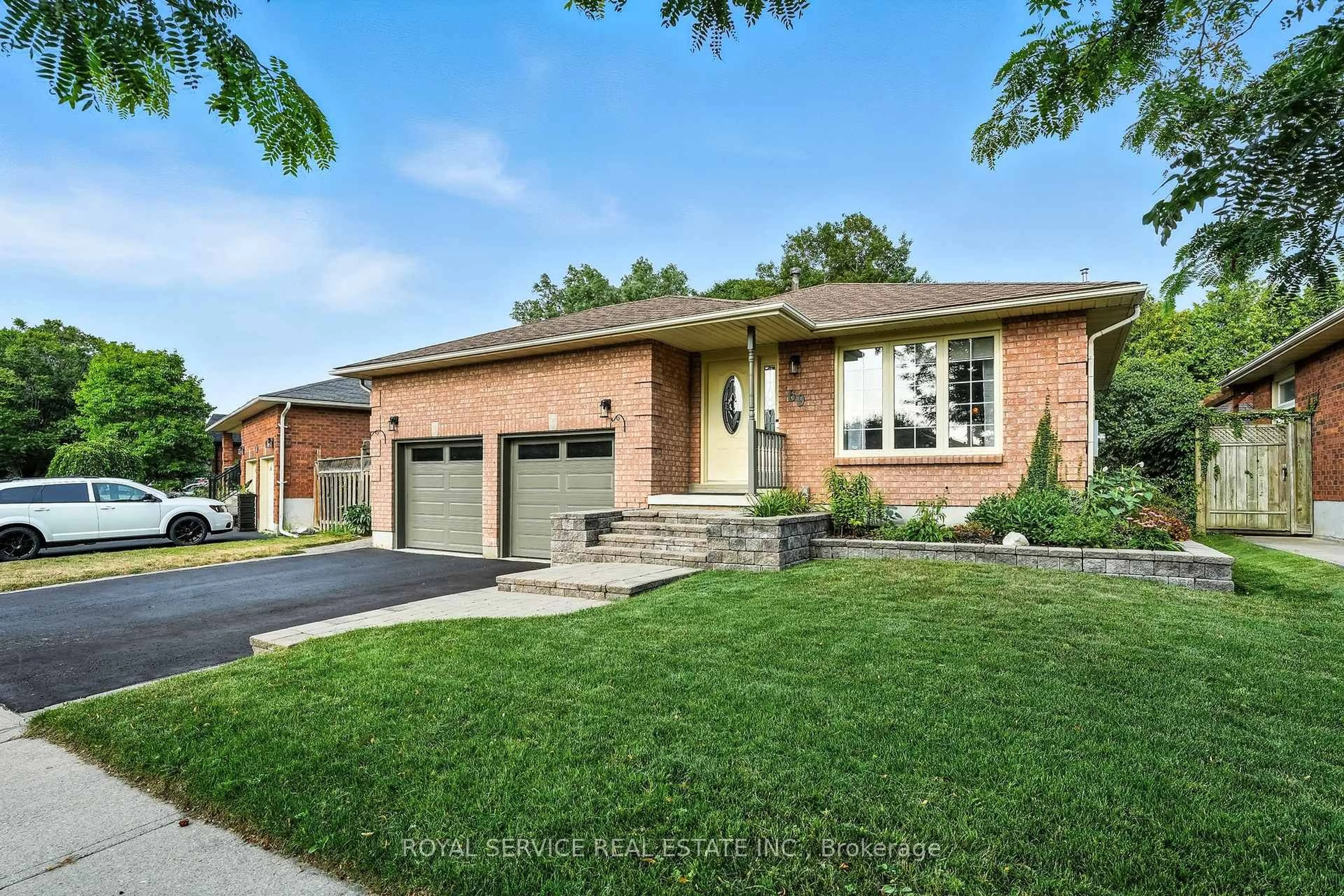 Home with brick exterior material, street for 69 Firwood Ave, Clarington Ontario L1E 2B2