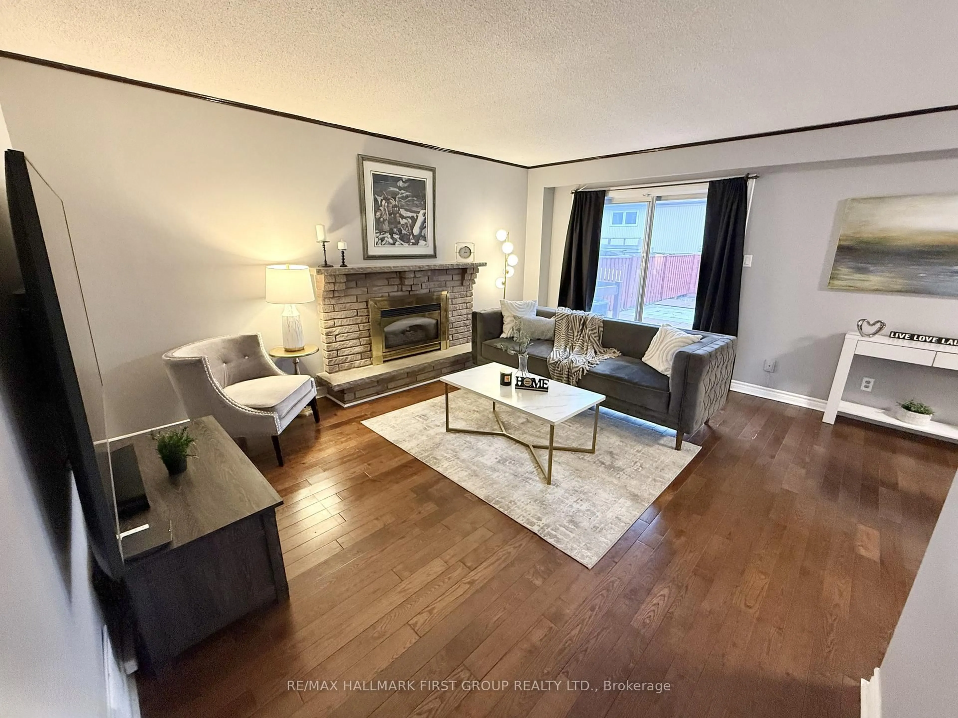 Living room with furniture, wood/laminate floor for 1762 Meadowview Ave, Pickering Ontario L1V 3G8