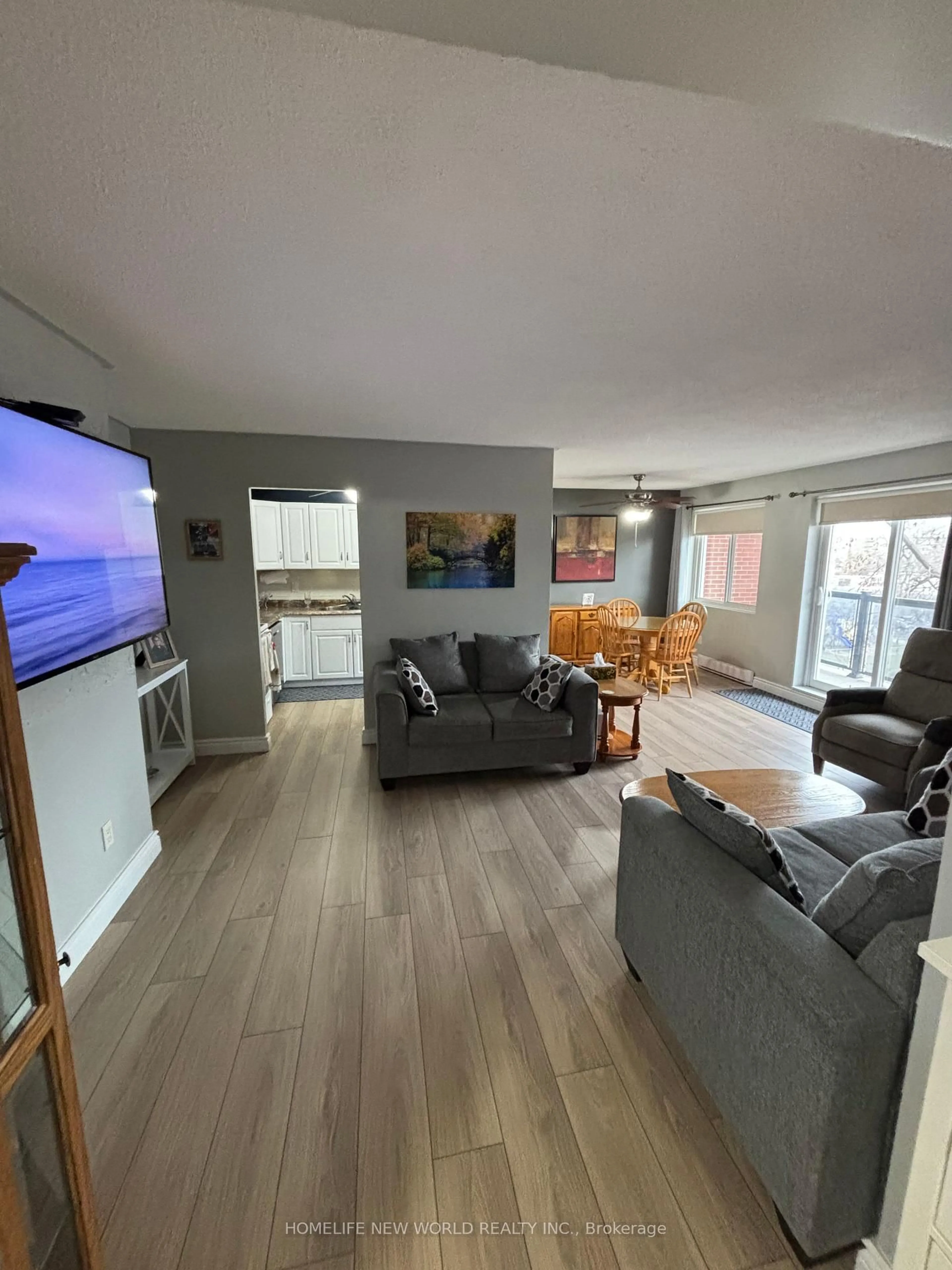 Living room with furniture, wood/laminate floor for 131 Taunton Rd #402, Oshawa Ontario L1G 3T8