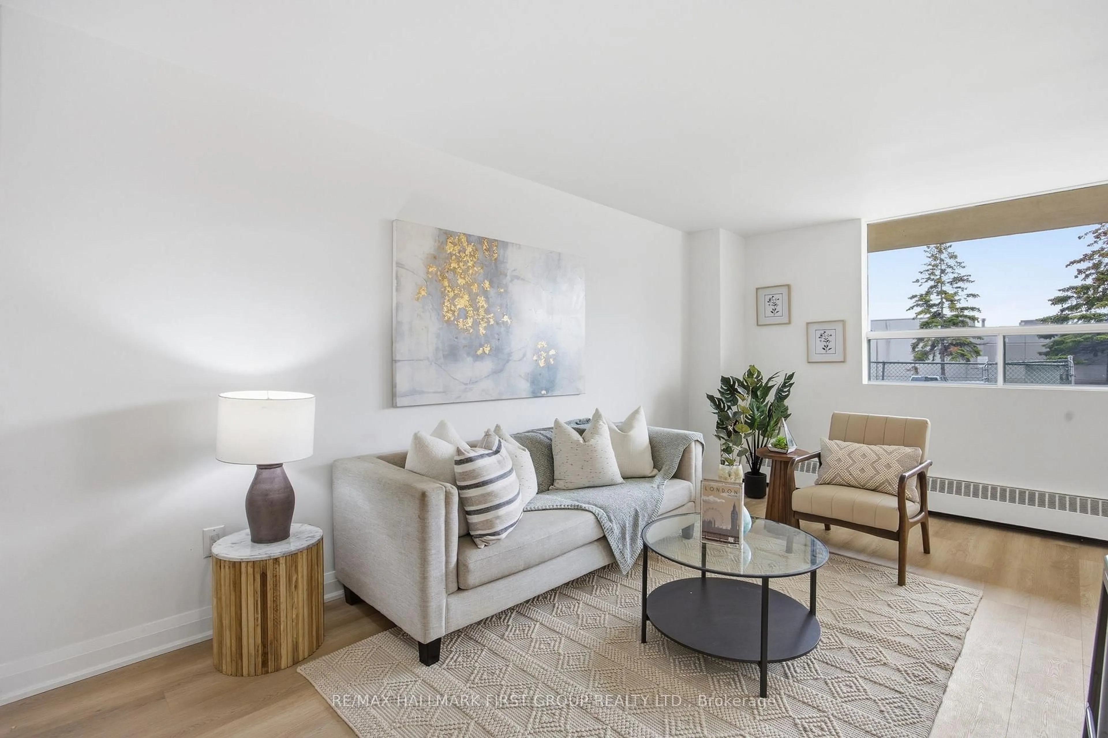 Living room with furniture, unknown for 1950 Kennedy Rd #101, Toronto Ontario M1P 4S9