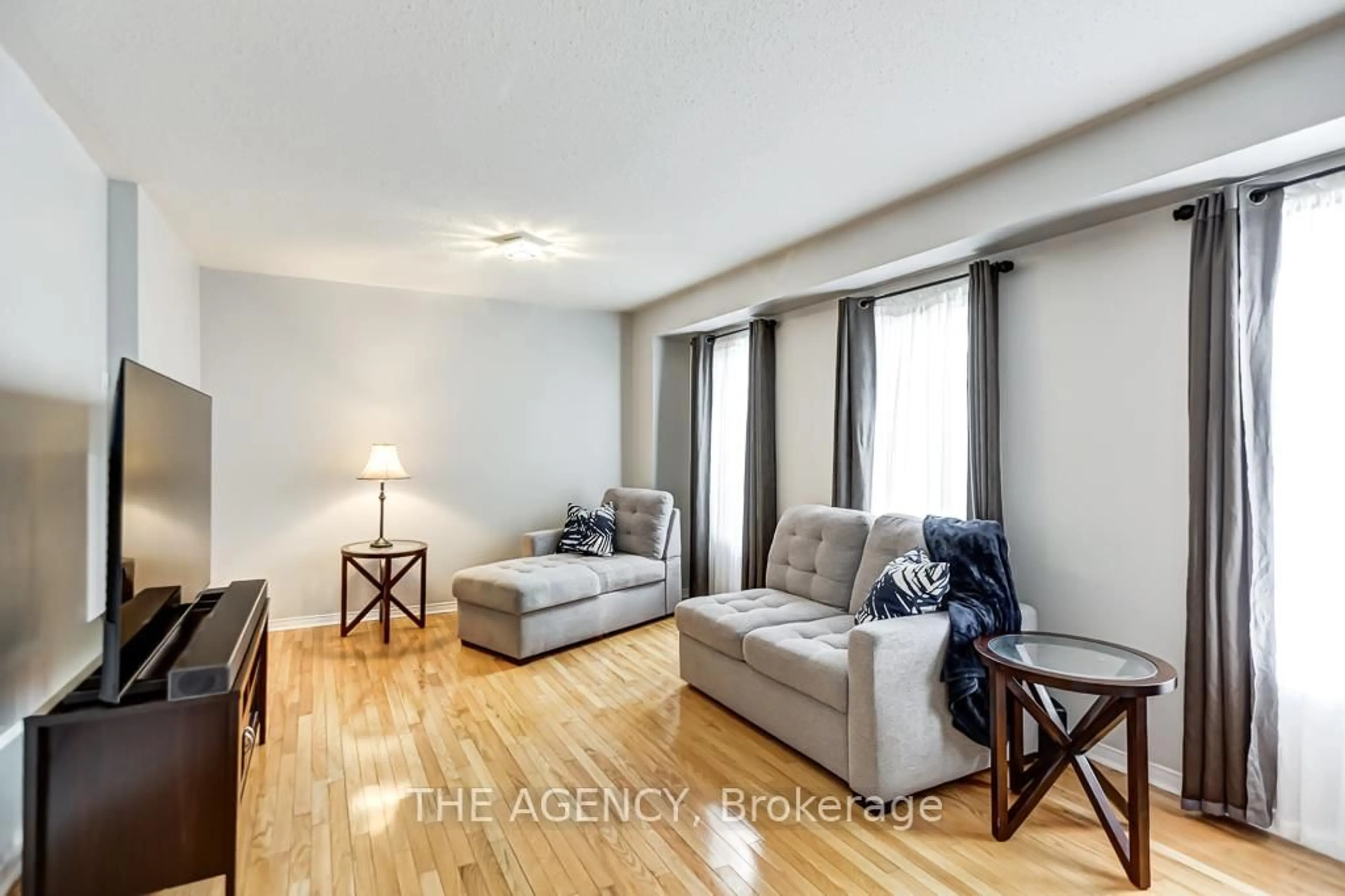 Living room with furniture, wood/laminate floor for 3241 Country Lane, Whitby Ontario L1P 1T5