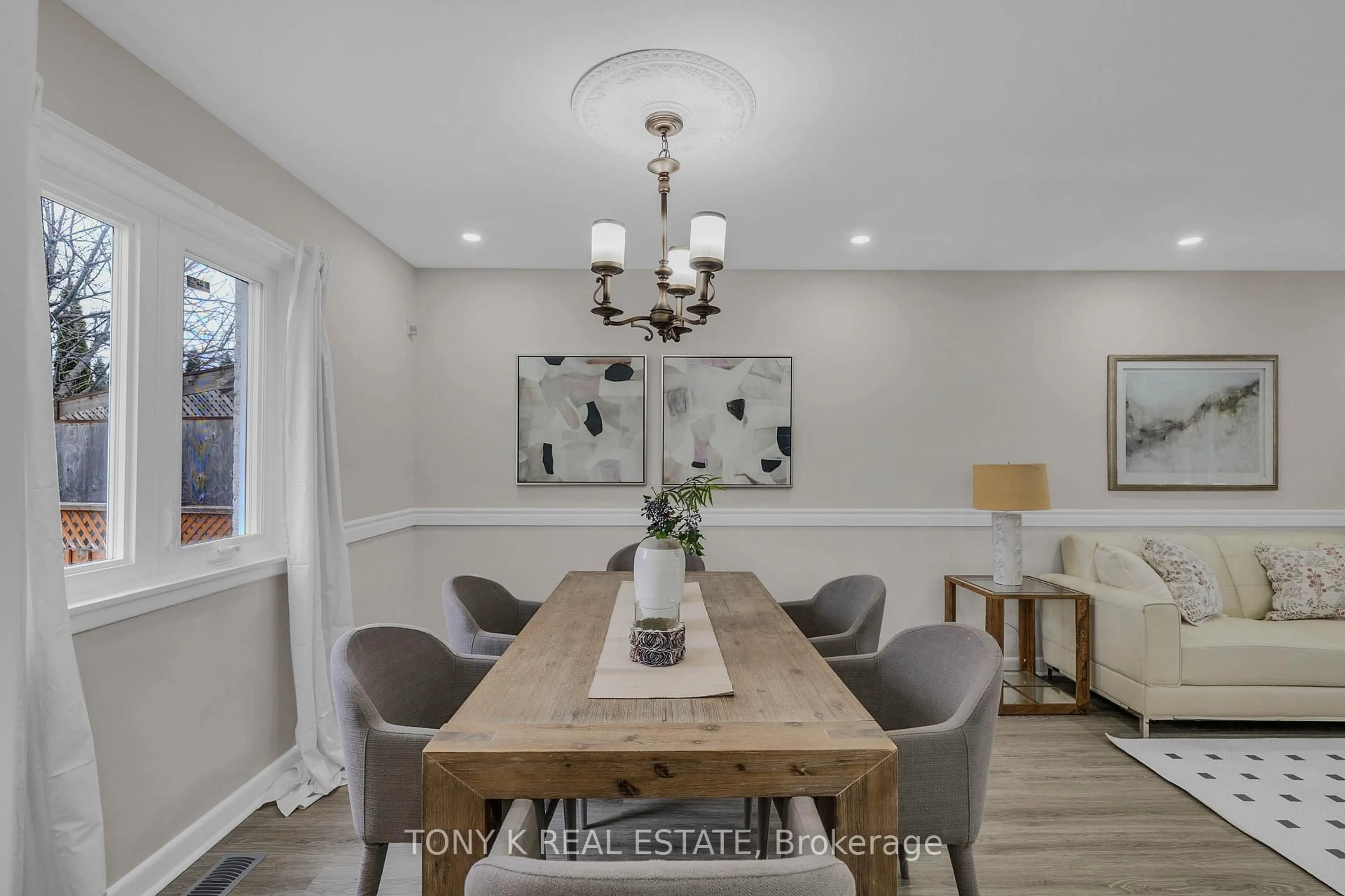 Dining room, wood/laminate floor for 65 Clapperton Ave, Toronto Ontario M1L 4K7