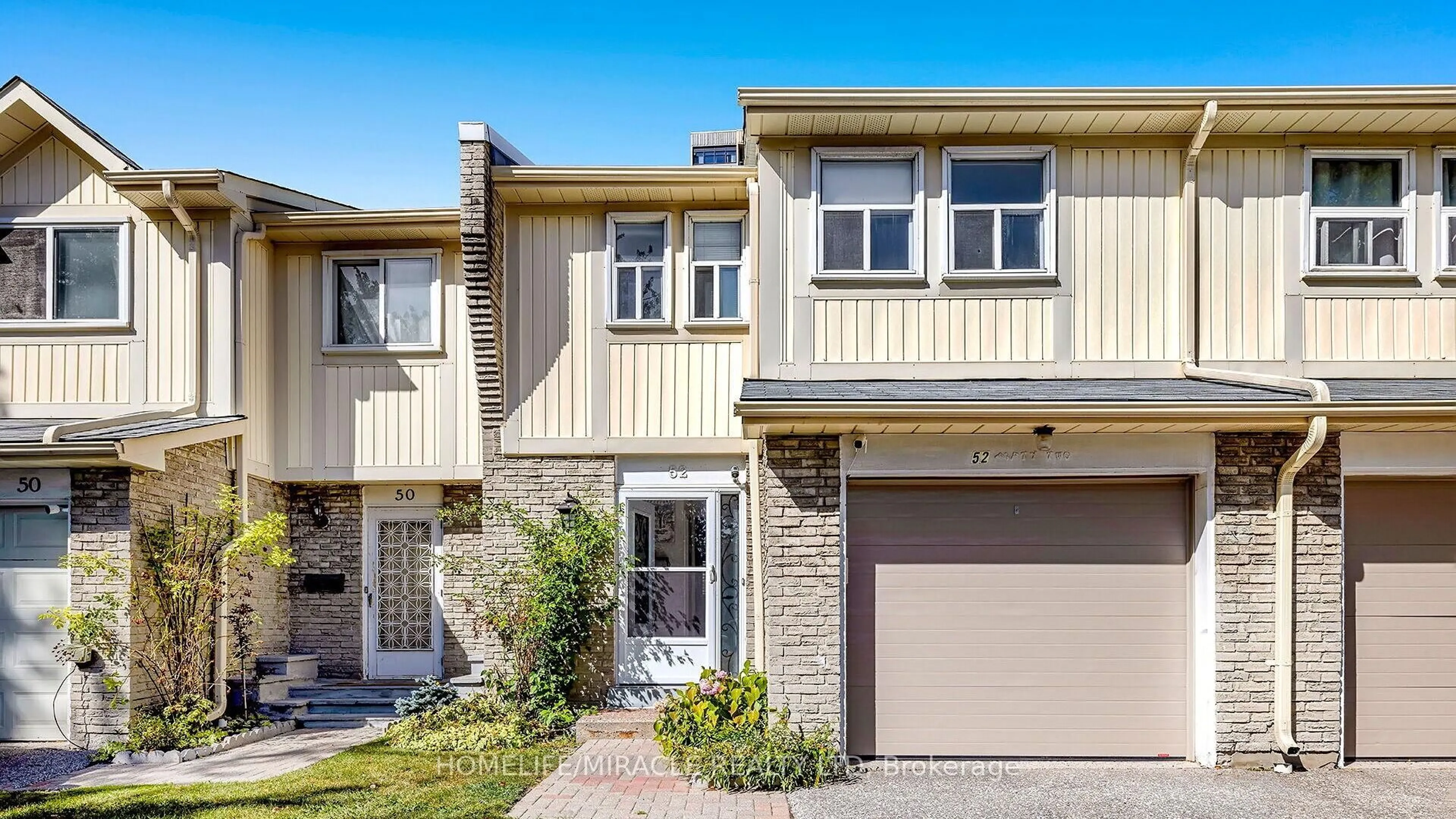 Home with vinyl exterior material, street for 1290 Bridletowne Circ #52, Toronto Ontario M1W 2V4