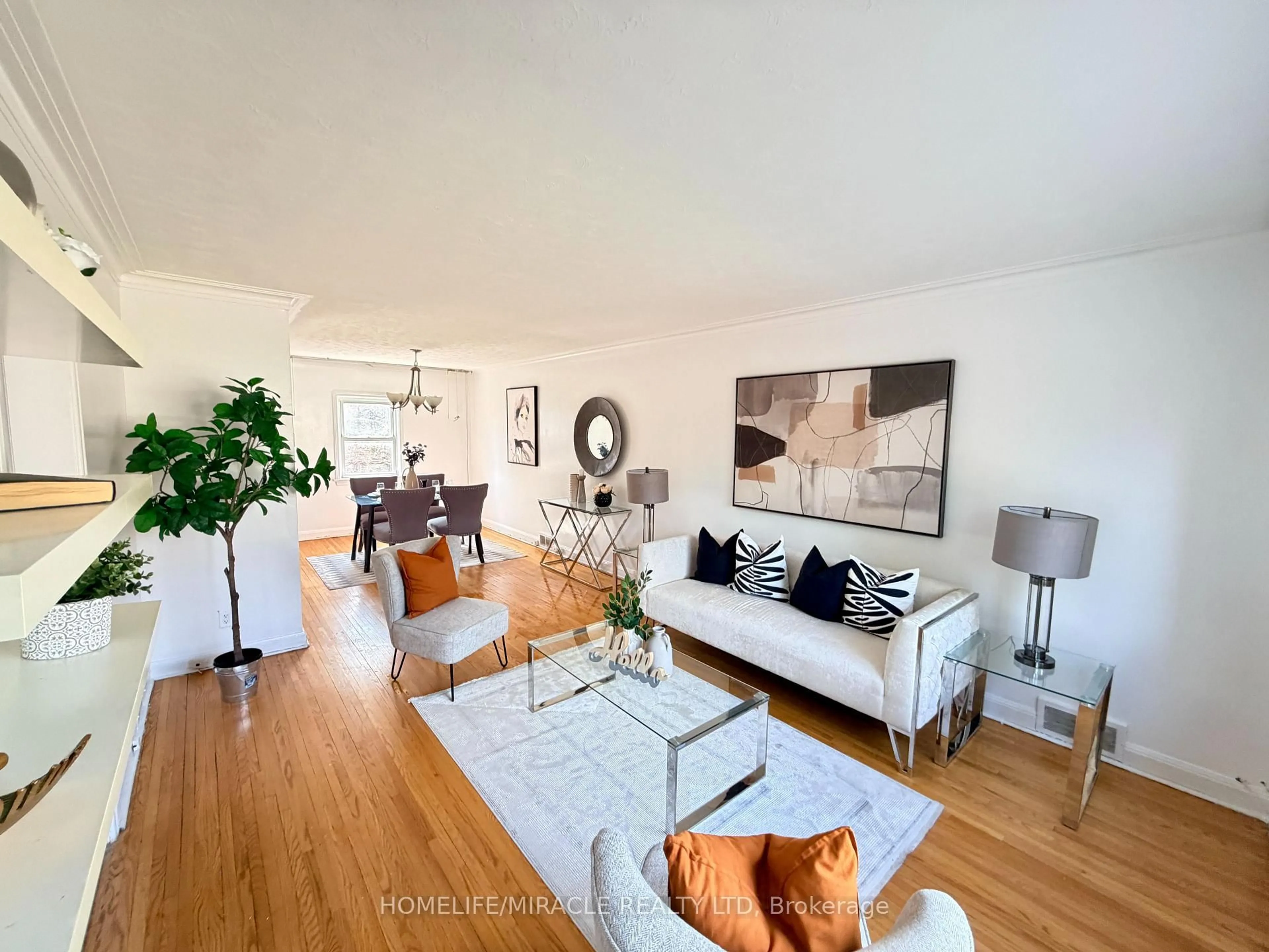 Living room with furniture, wood/laminate floor for 12 Roselm Rd, Toronto Ontario M1R 3Y6