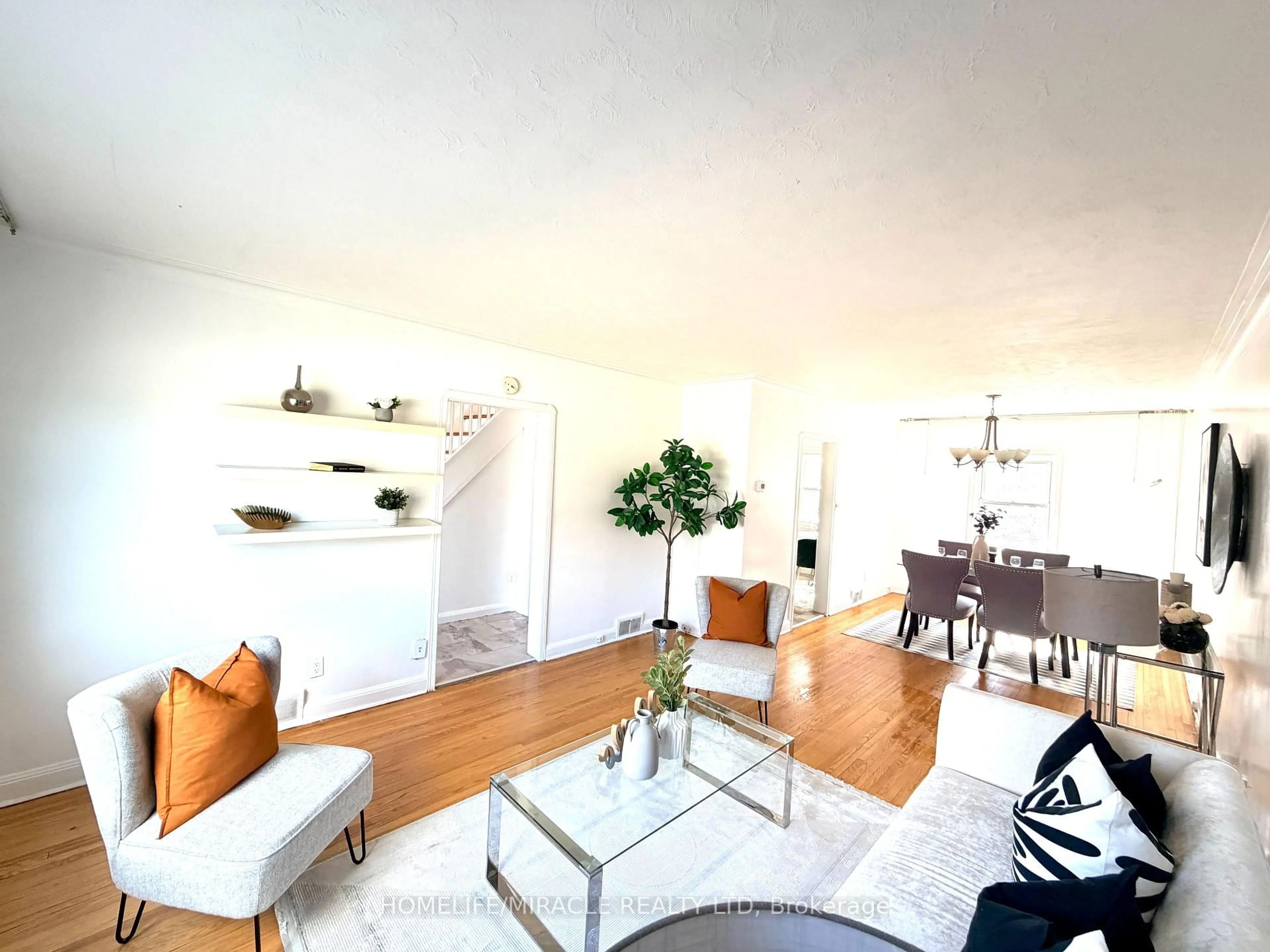 Living room with furniture, wood/laminate floor for 12 Roselm Rd, Toronto Ontario M1R 3Y6