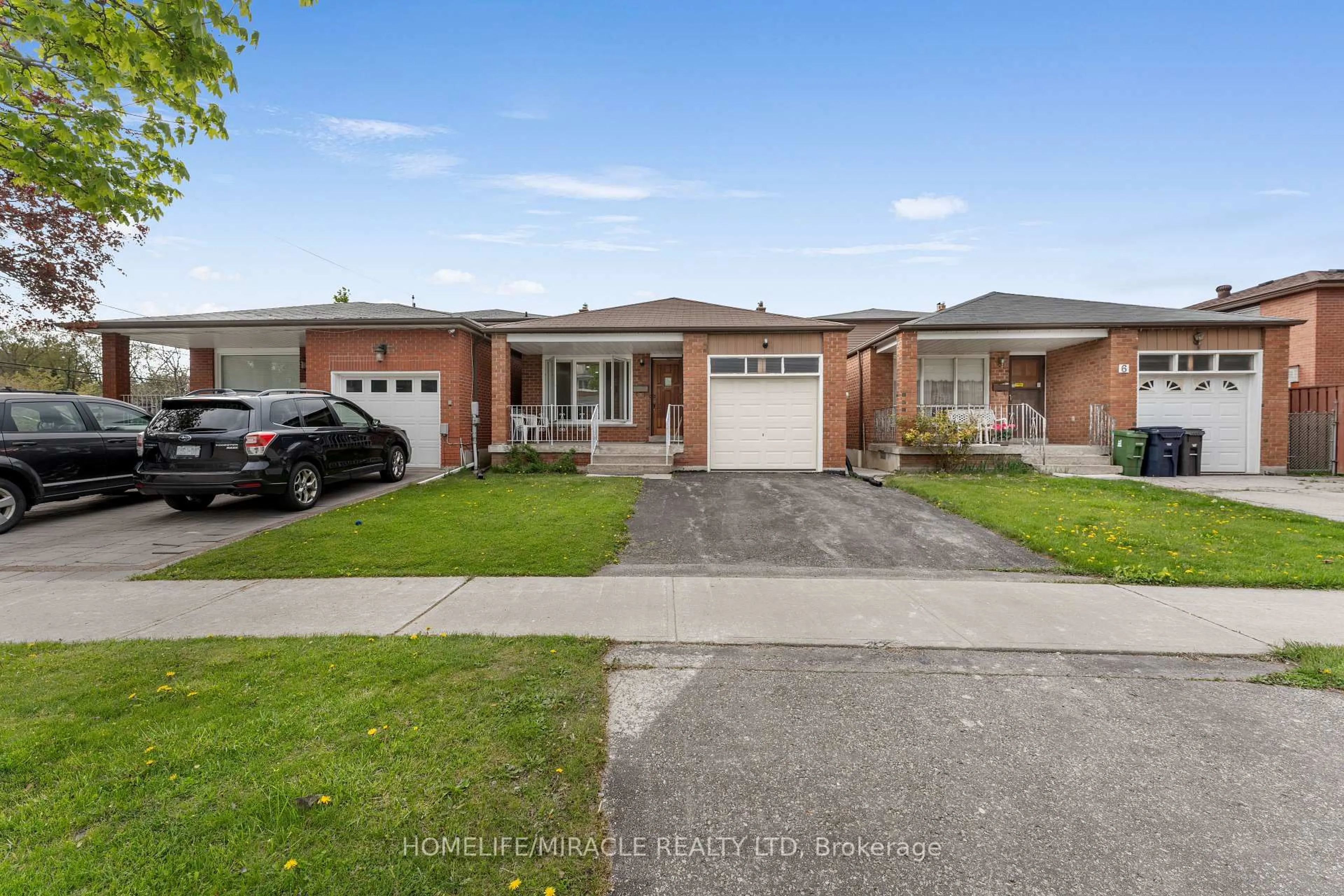 Home with brick exterior material, street for 4 Greendowns Dr, Toronto Ontario M1M 2G7