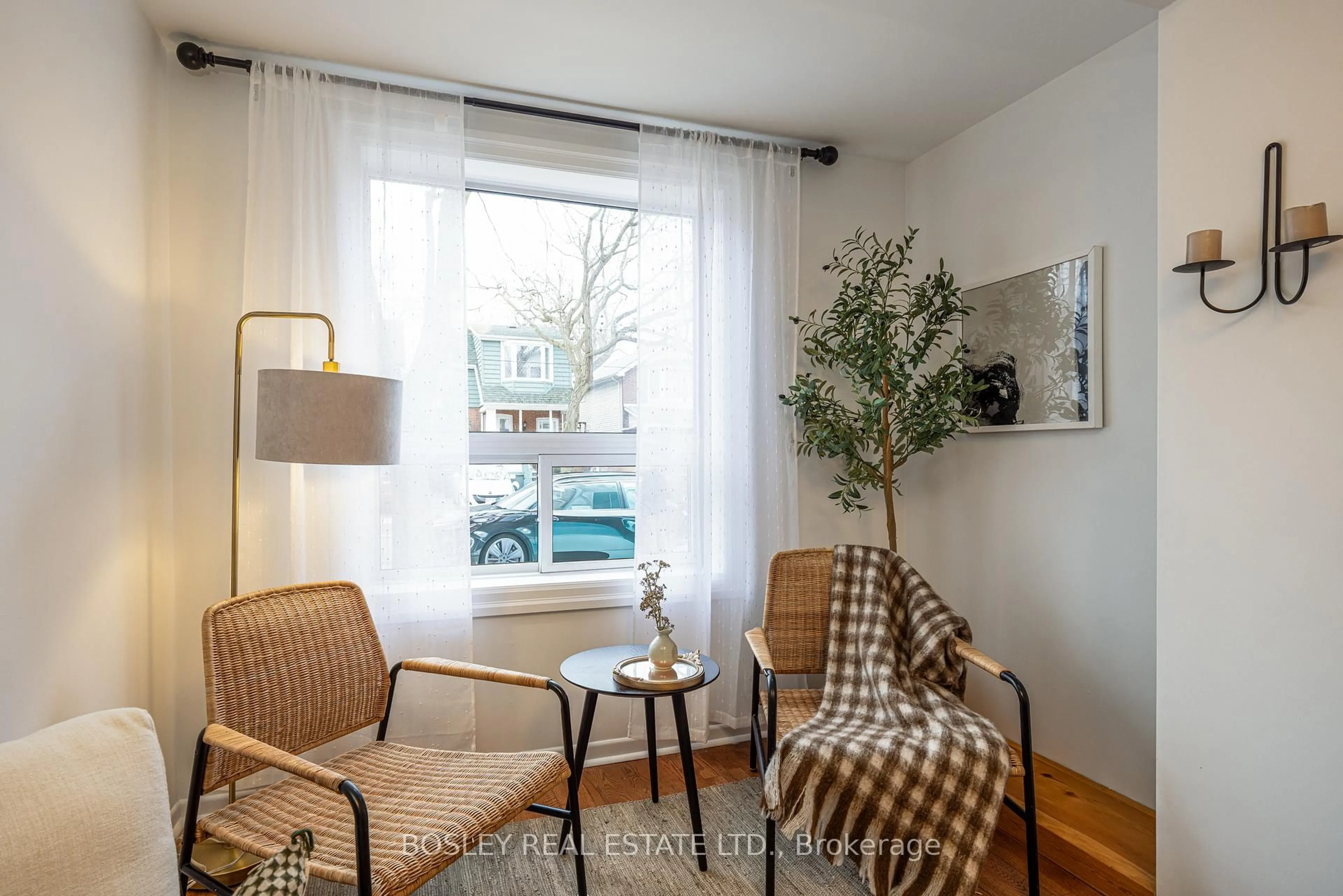 Living room with furniture, wood/laminate floor for 195 Rhodes Ave, Toronto Ontario M4L 3A2