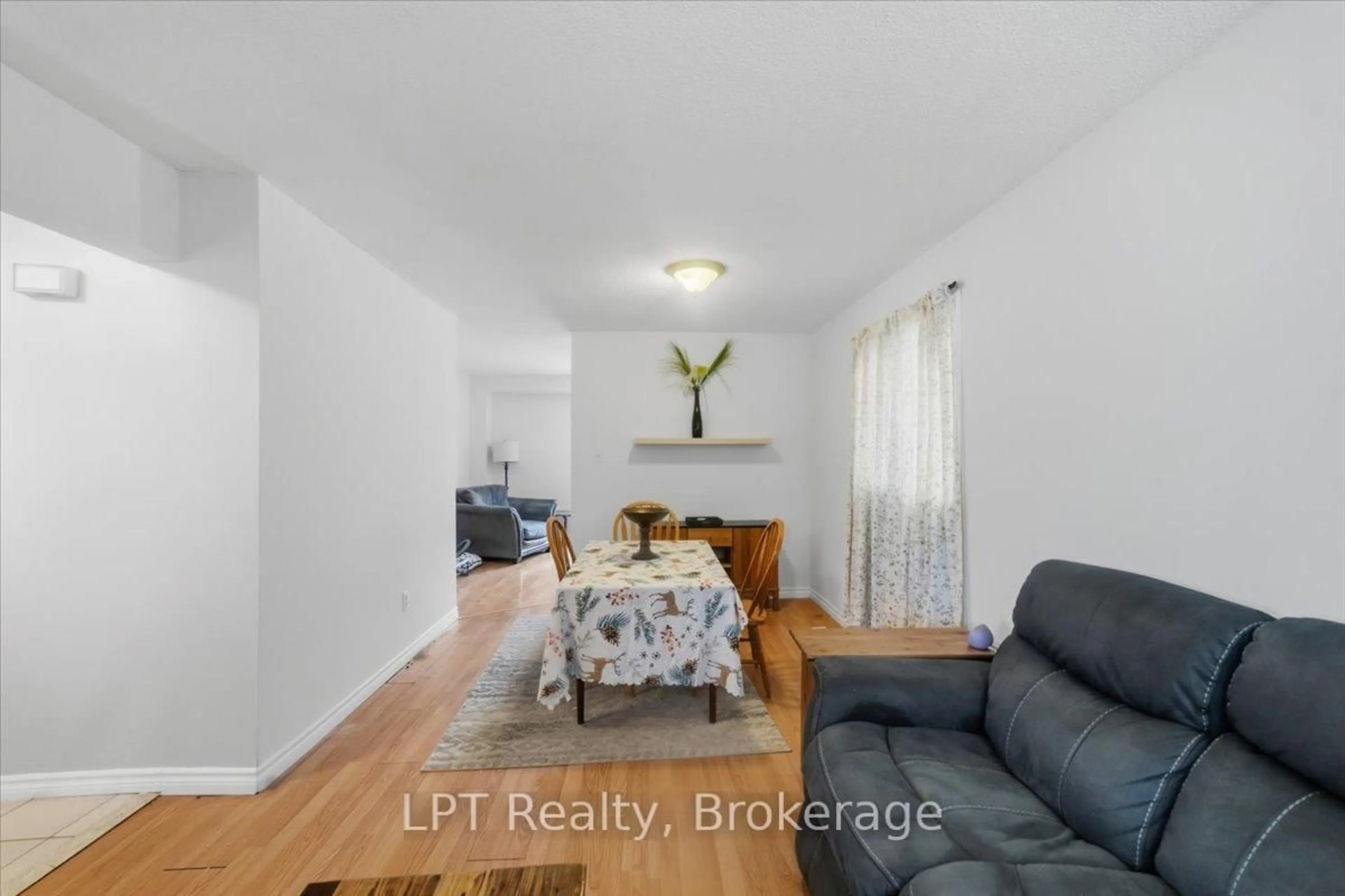 Living room with furniture, wood/laminate floor for 22 Miles Dr, Ajax Ontario L1Z 1C7