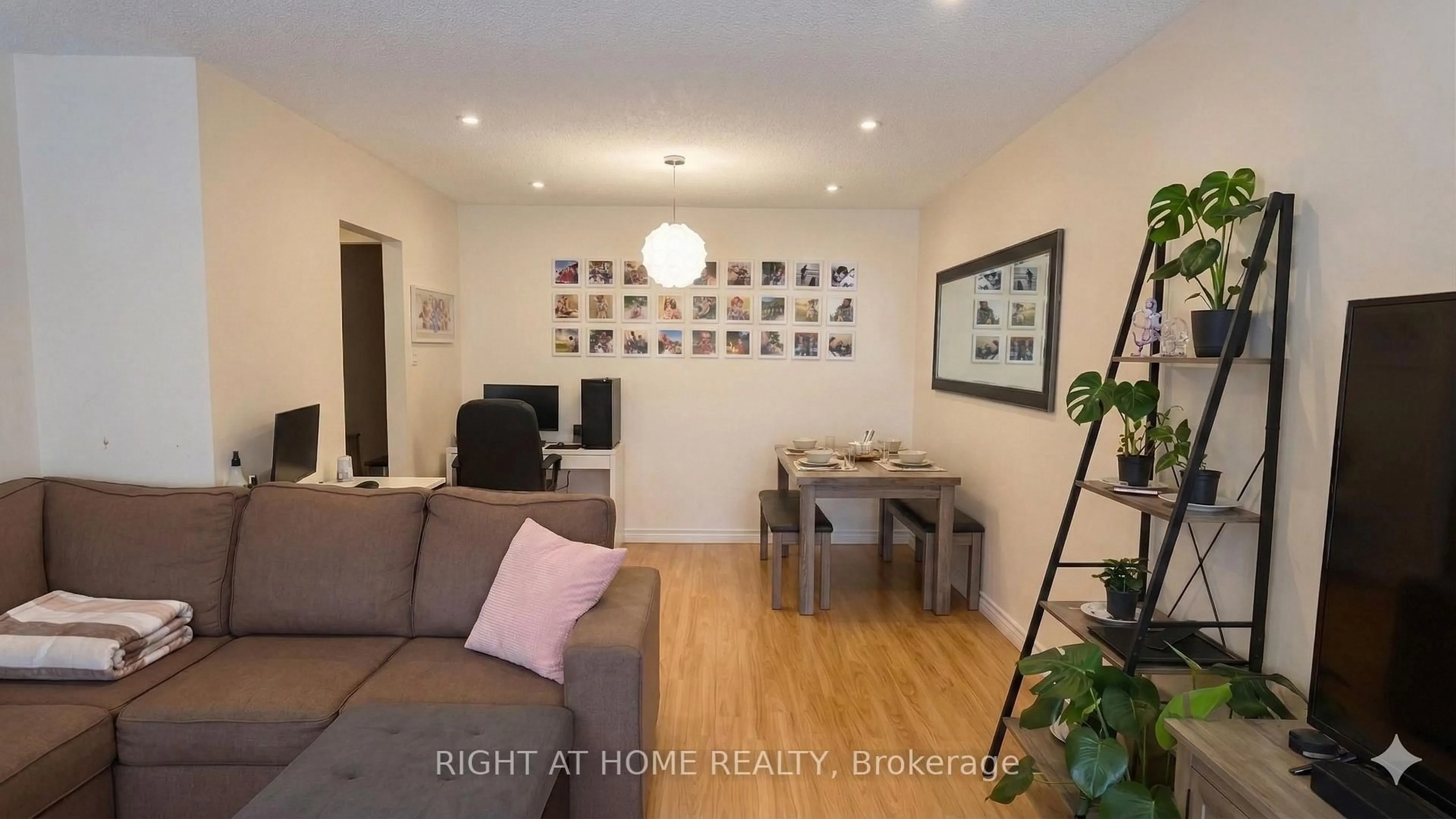 Living room with furniture, wood/laminate floor for 81 Heaslip Terr, Toronto Ontario M1T 1W8