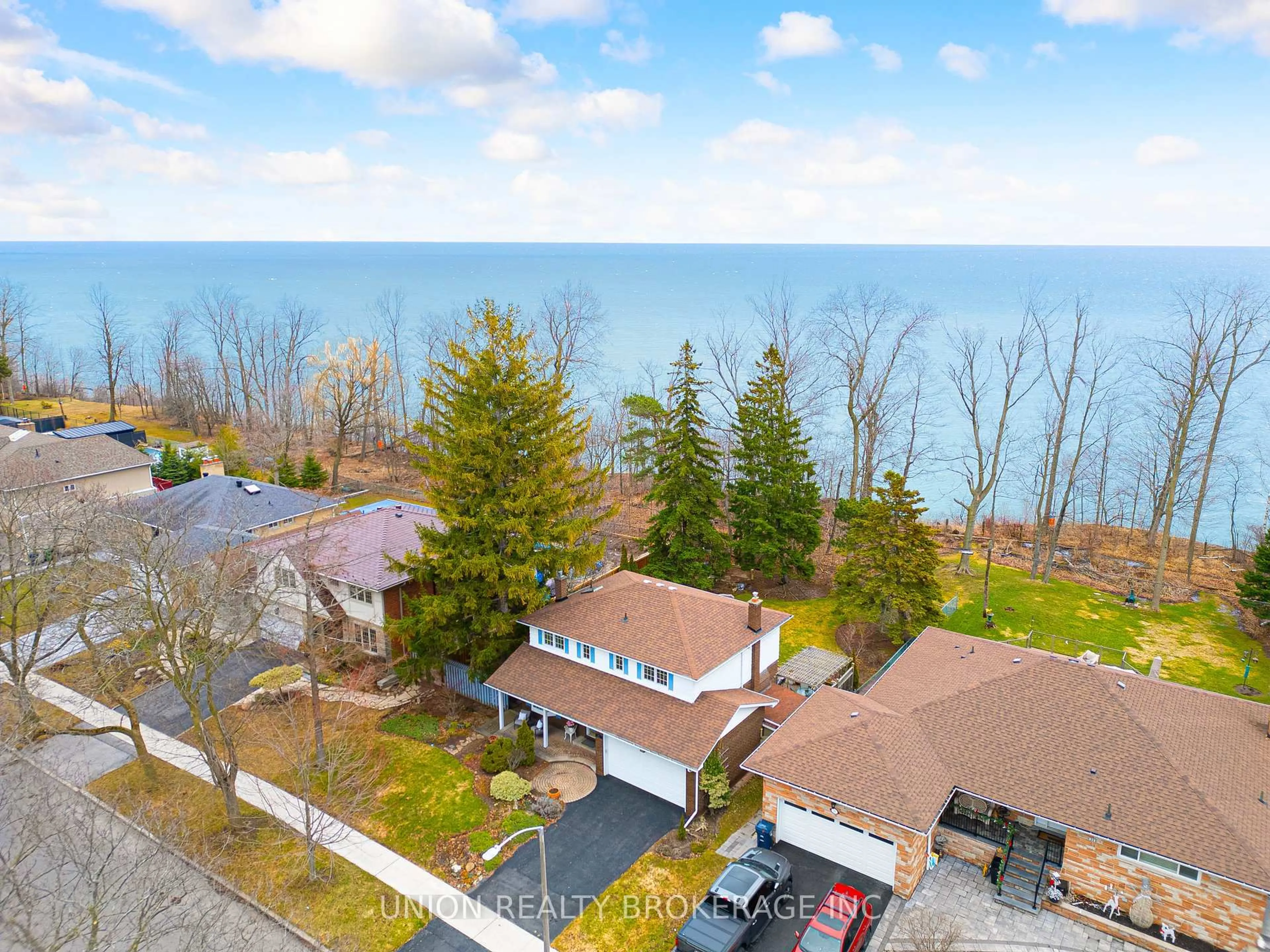 A pic from outside/outdoor area/front of a property/back of a property/a pic from drone, water/lake/river/ocean view for 27 South Marine Dr, Toronto Ontario M1E 1A1