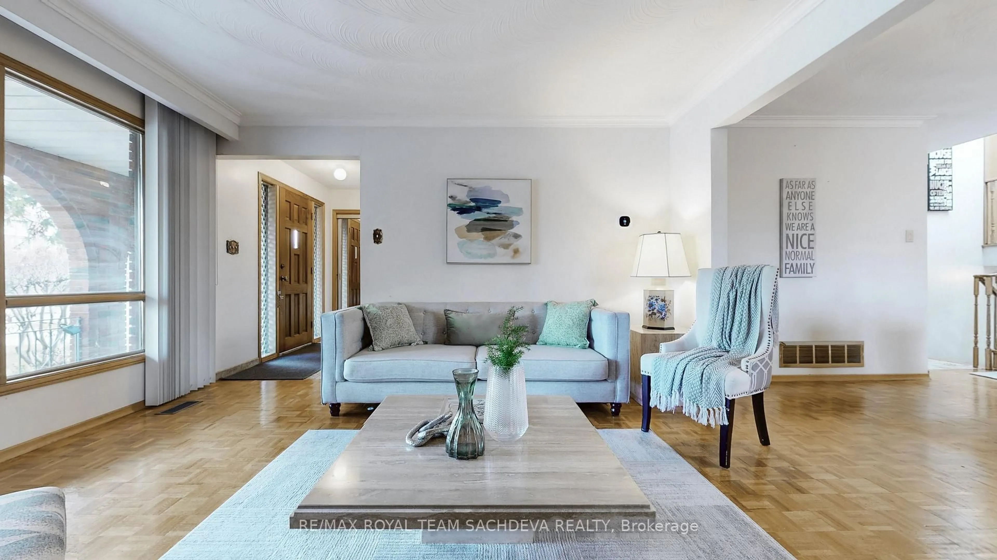 Living room with furniture, wood/laminate floor for 4611 Kingston Rd, Toronto Ontario M1E 2P5