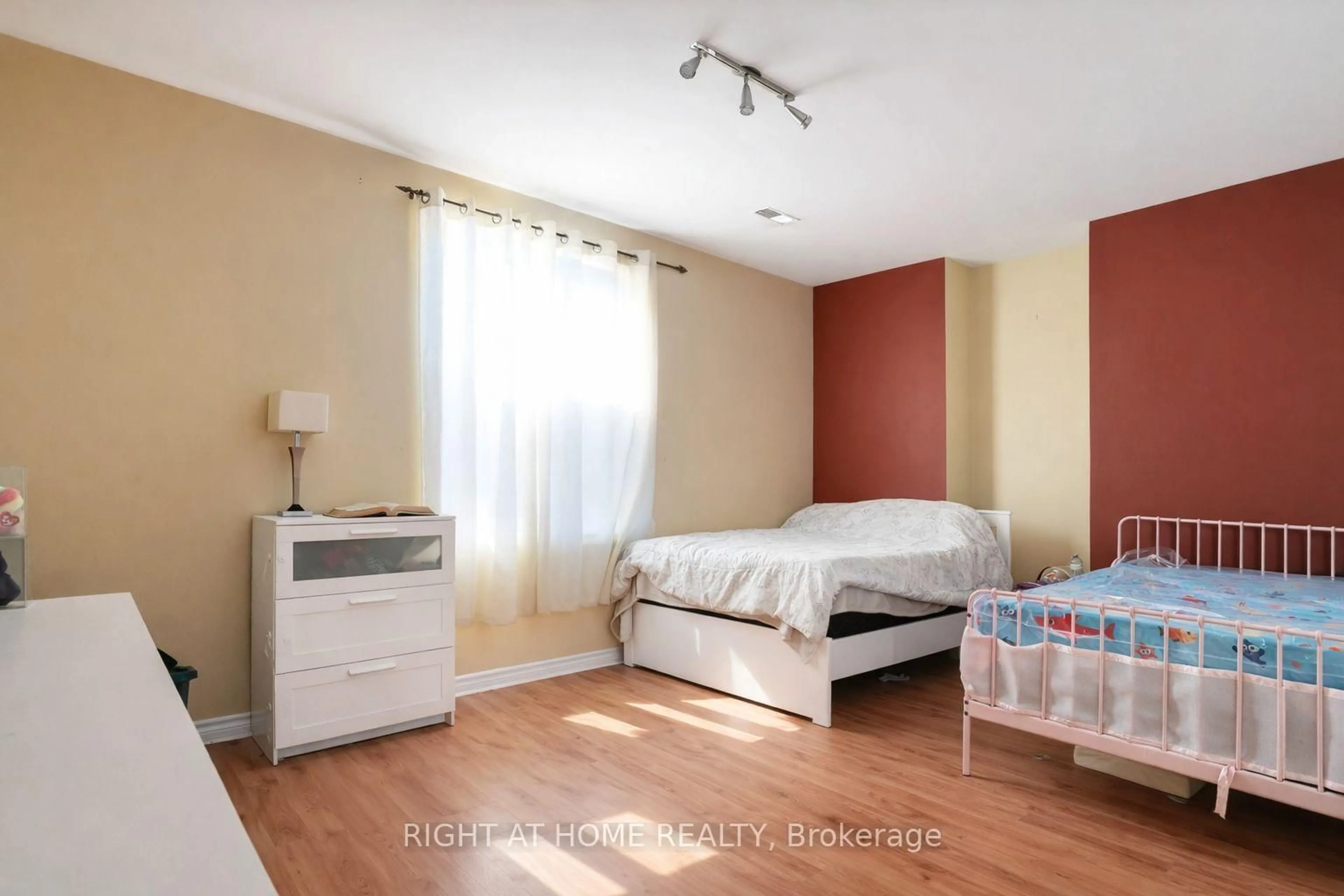 Bedroom with bed, wood/laminate floor for 169 Dooley Cres, Ajax Ontario L1T 4J7