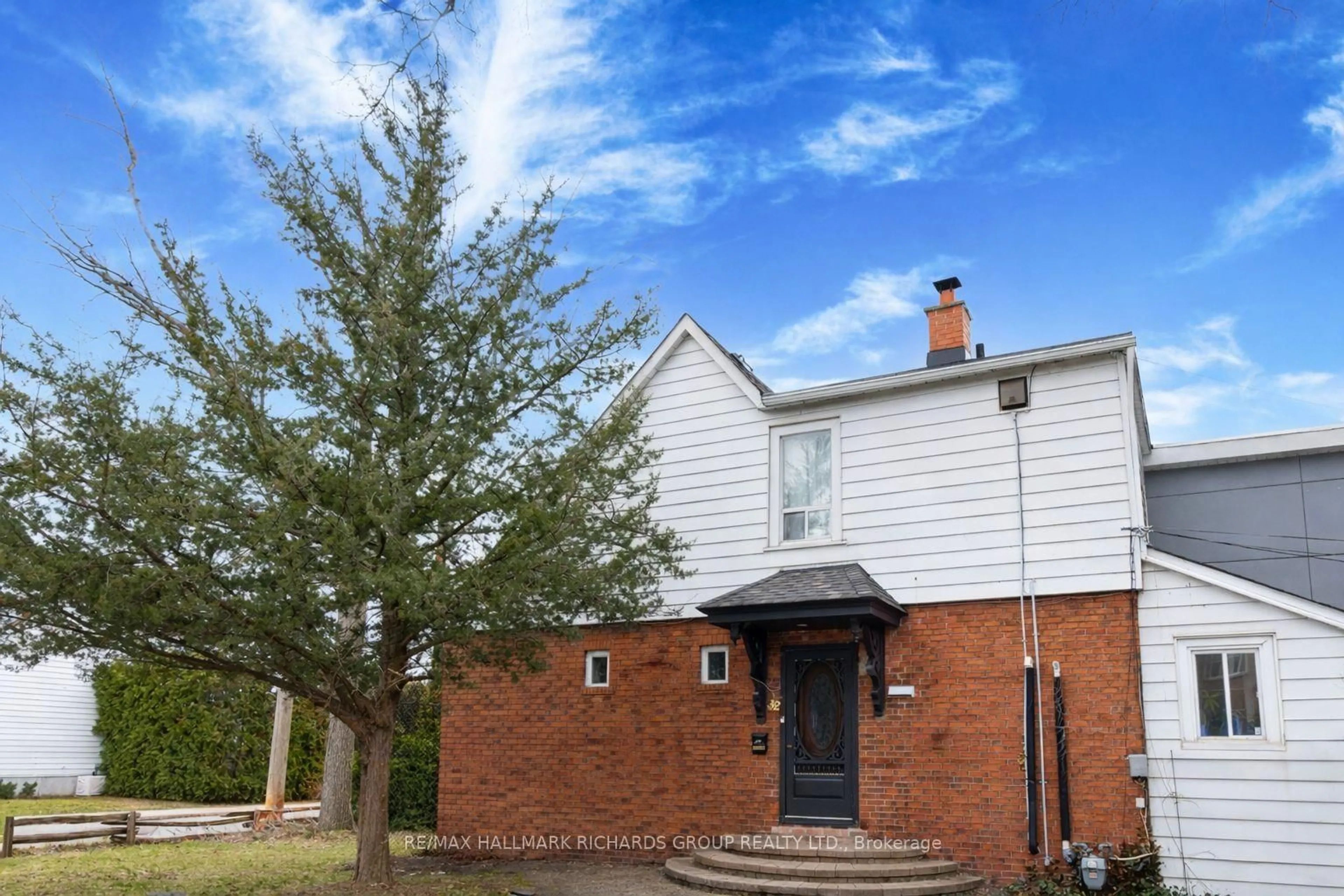 Home with brick exterior material, street for 32 Costain Ave, Toronto Ontario M4E 2G6