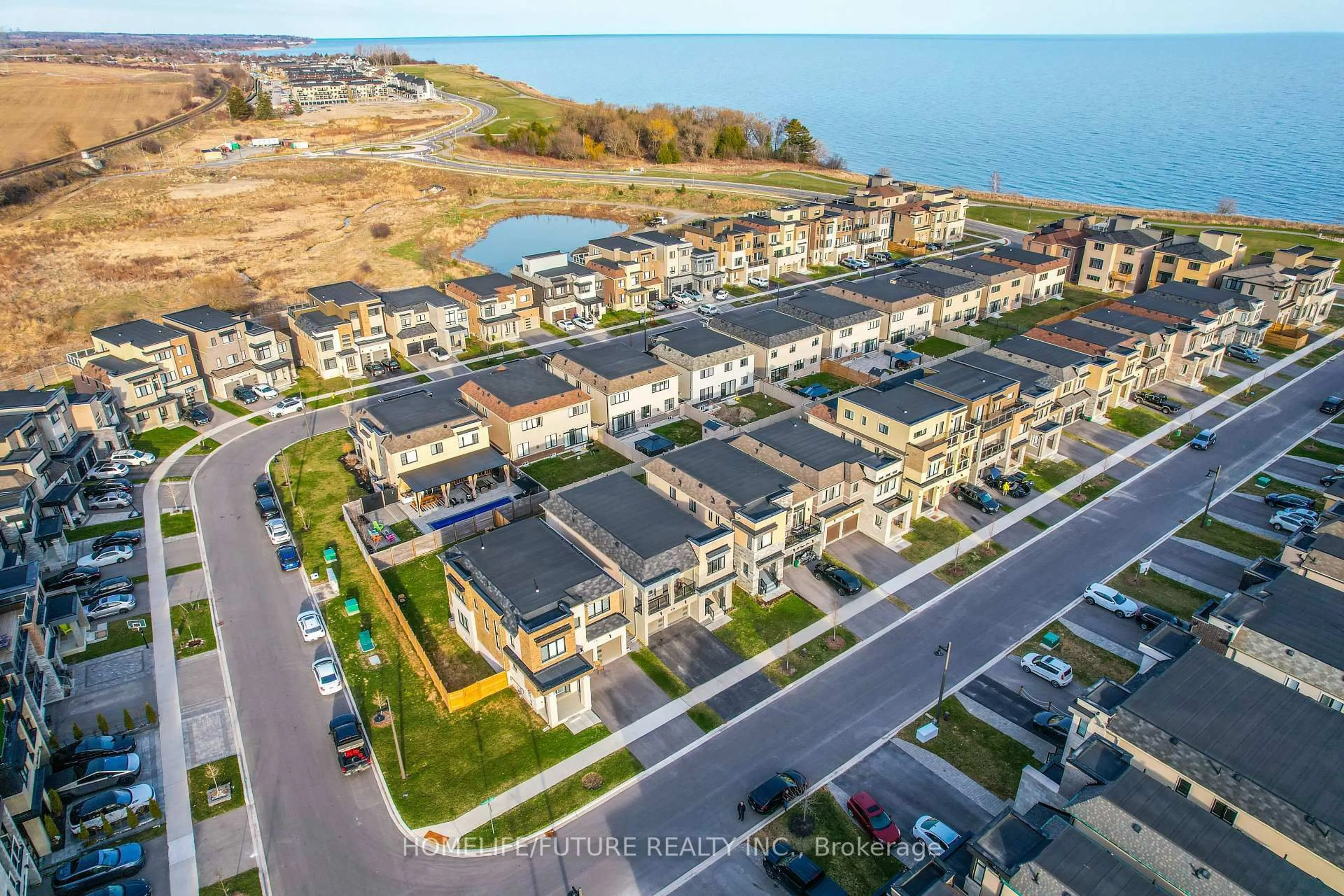 A pic from outside/outdoor area/front of a property/back of a property/a pic from drone, water/lake/river/ocean view for 47 Clipper Lane, Clarington Ontario L1C 4B1