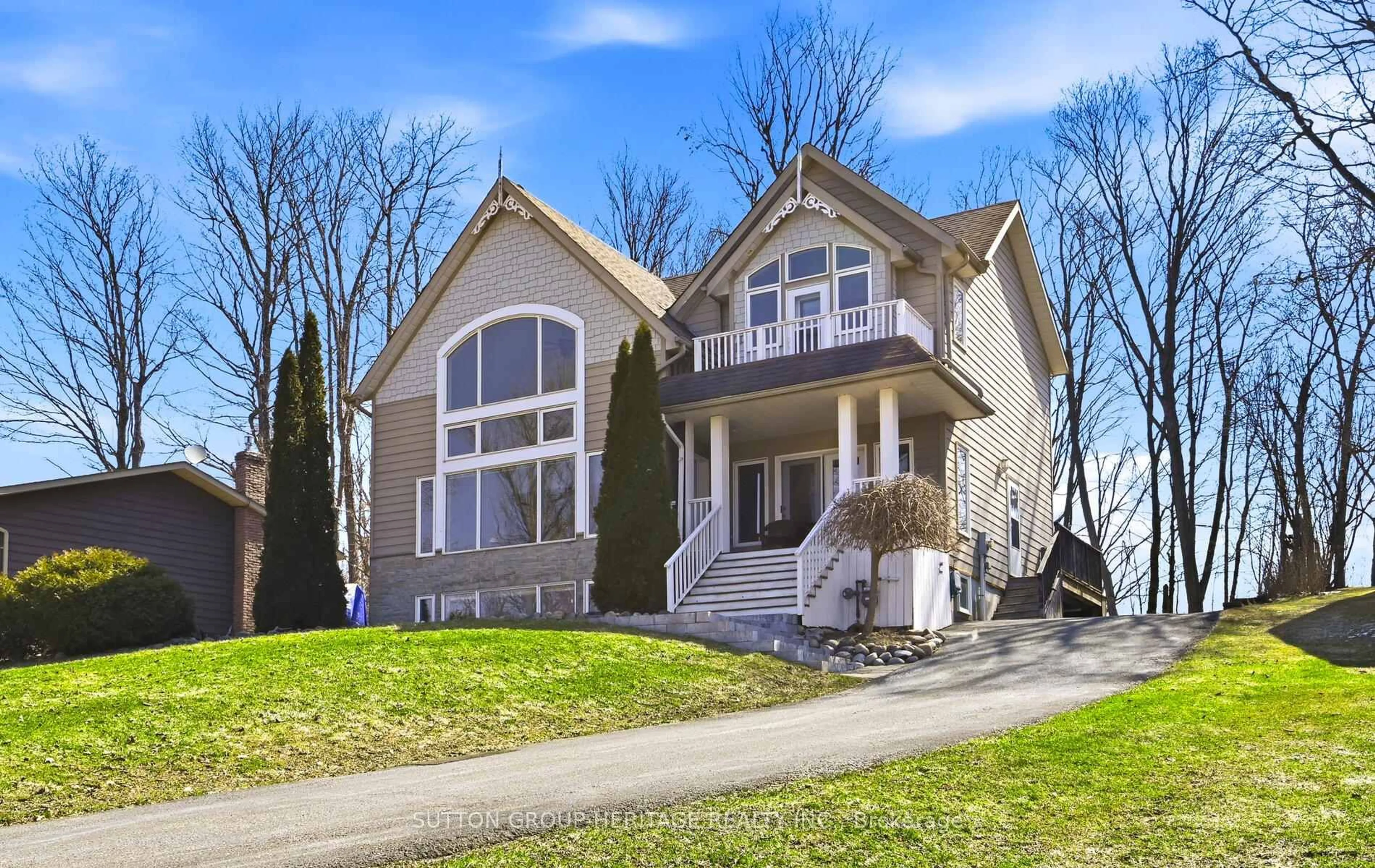 Home with vinyl exterior material, street for 499 Fralicks Beach Rd, Scugog Ontario L9L 1B6