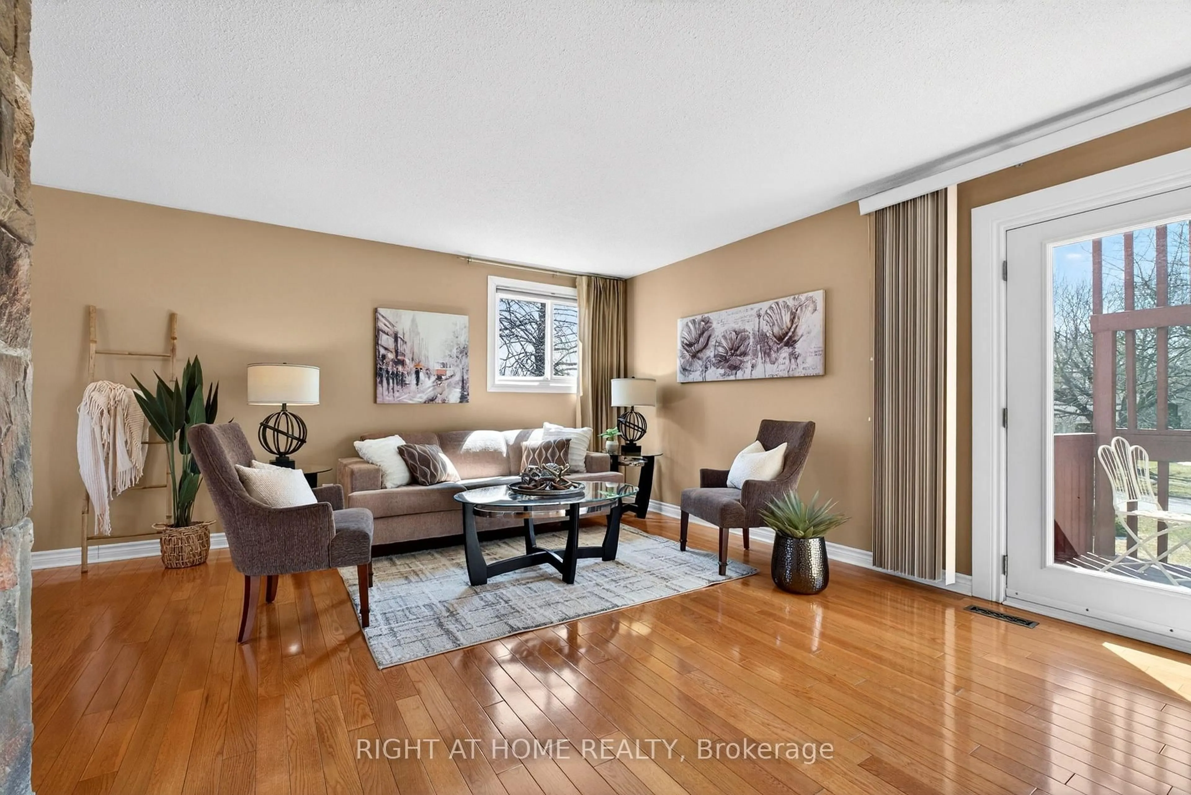 Living room with furniture, wood/laminate floor for 249 Lorindale Dr, Oshawa Ontario L1H 6X5