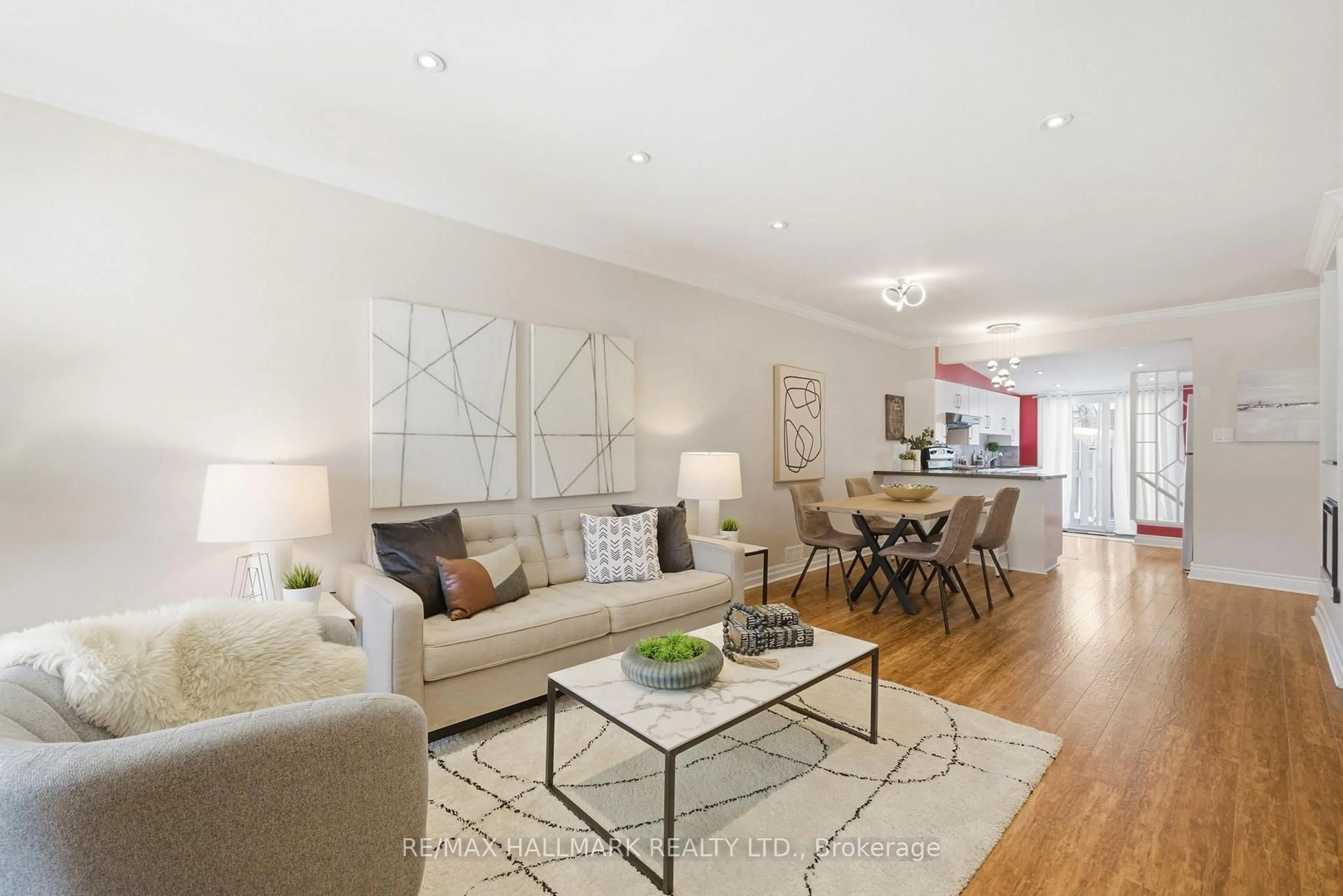 Living room with furniture, wood/laminate floor for 1002 Victoria Park Ave, Toronto Ontario M4B 2J6