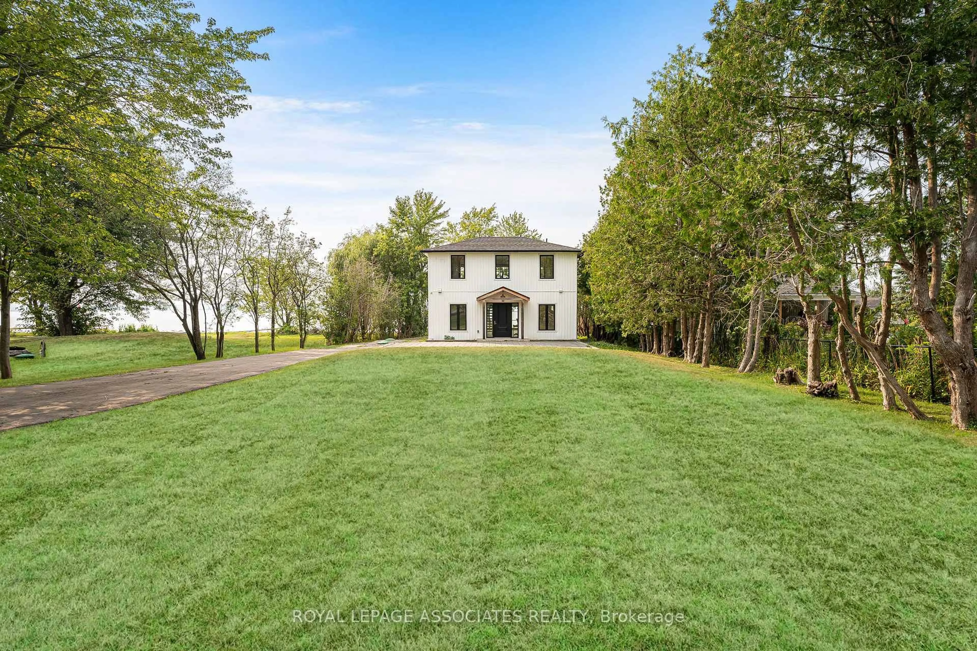 A pic from outside/outdoor area/front of a property/back of a property/a pic from drone, water/lake/river/ocean view for 46 Williams Point Rd, Scugog Ontario L0B 1E0