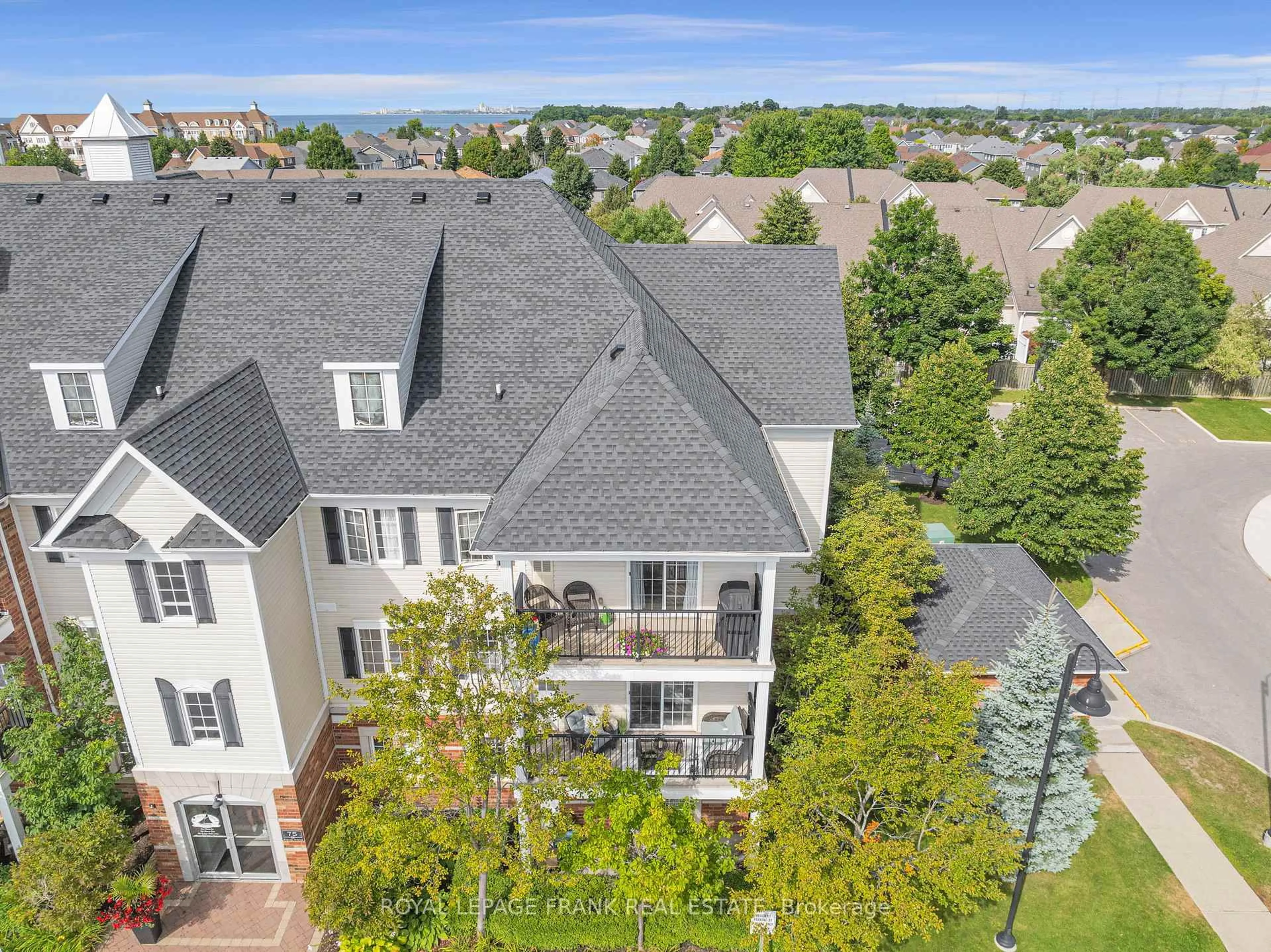 A pic from outside/outdoor area/front of a property/back of a property/a pic from drone, city buildings view from balcony for 75 Shipway Ave #301, Clarington Ontario L1B 0B8