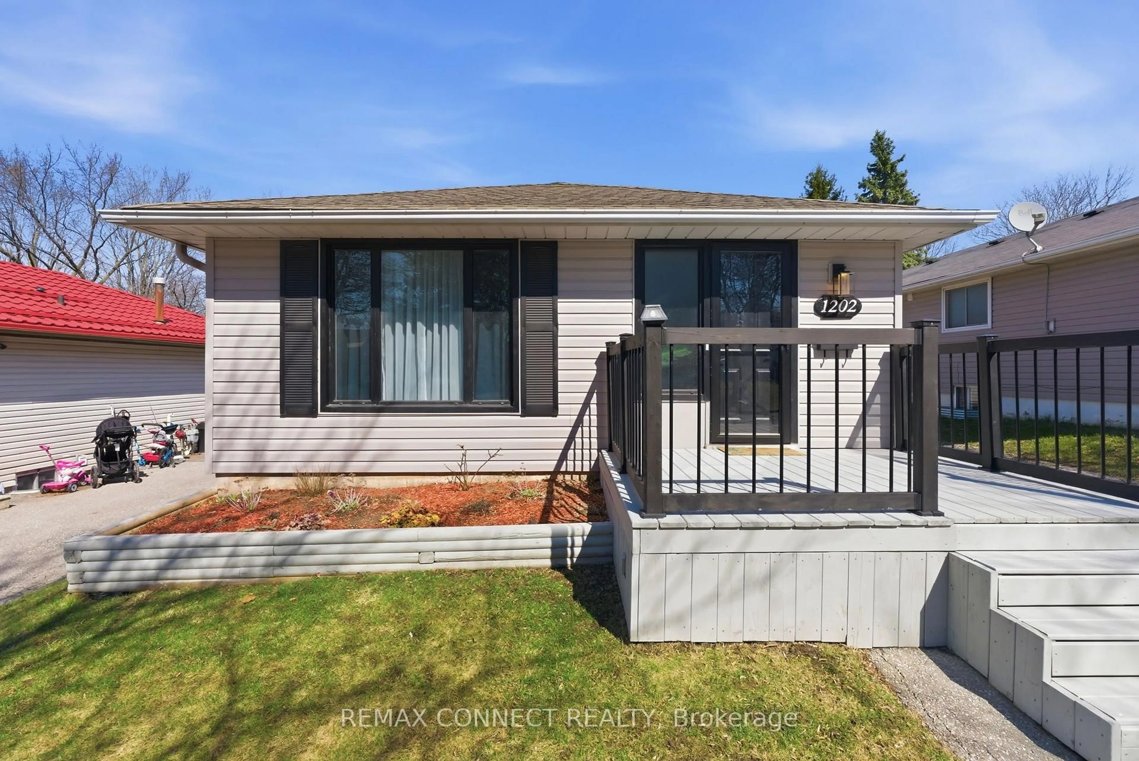 Home with vinyl exterior material, street for 1202 Norman Crt, Oshawa Ontario L1H 7X2