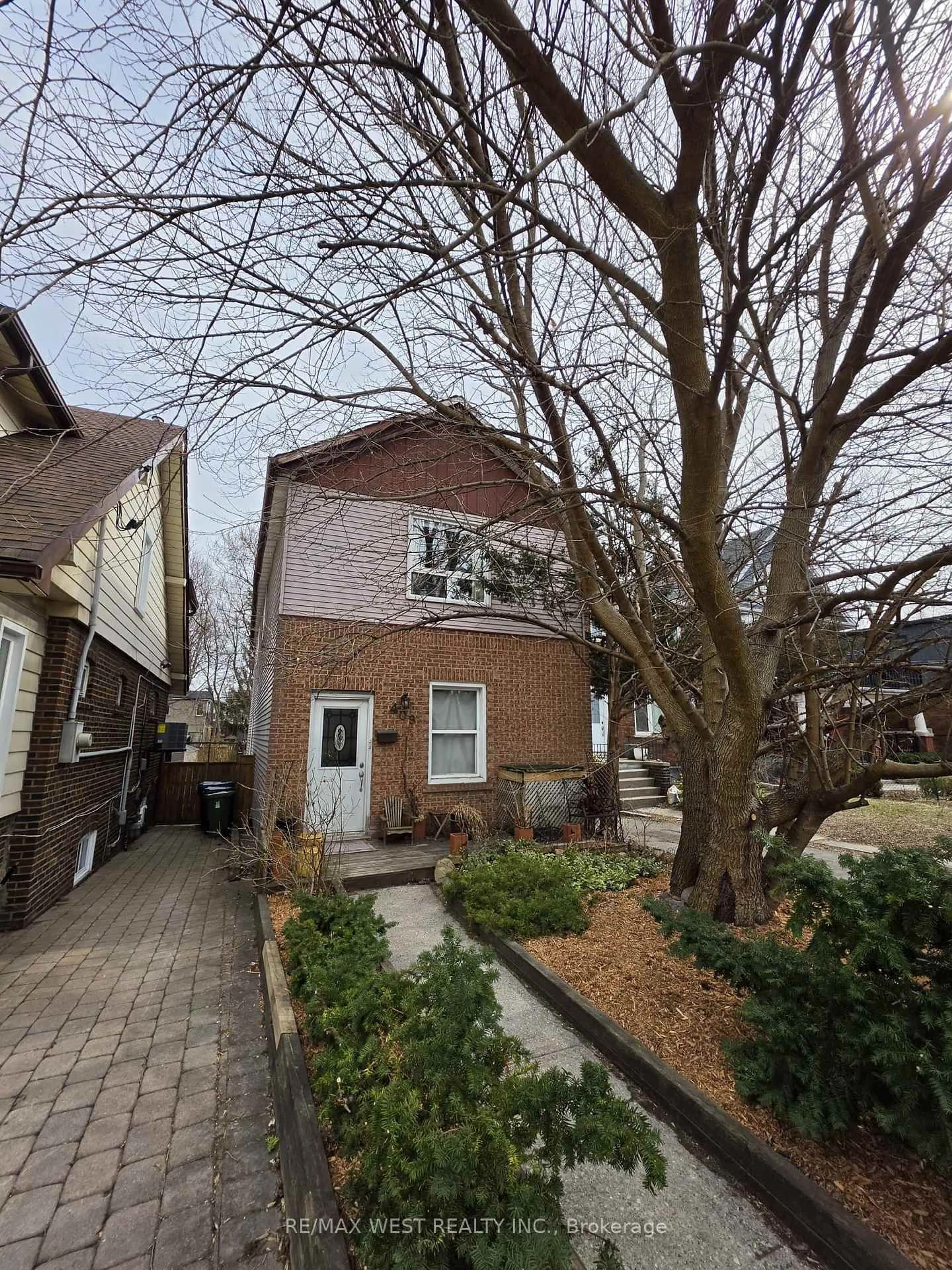 Home with brick exterior material, street for 409 Woodbine Ave, Toronto Ontario M4L 3P7