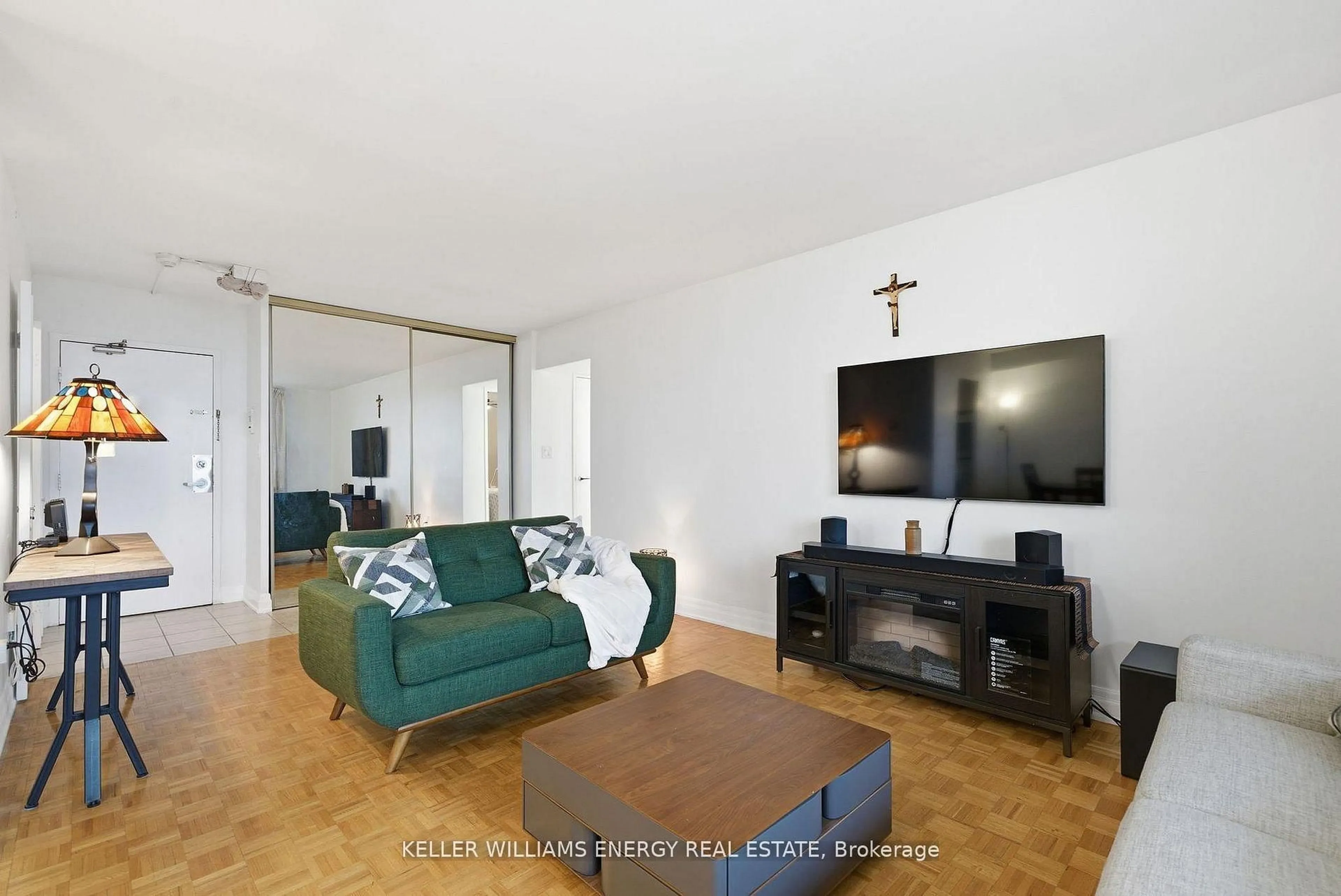 Living room with furniture, wood/laminate floor for 1 Massey Sq #1514, Toronto Ontario M4C 5L4