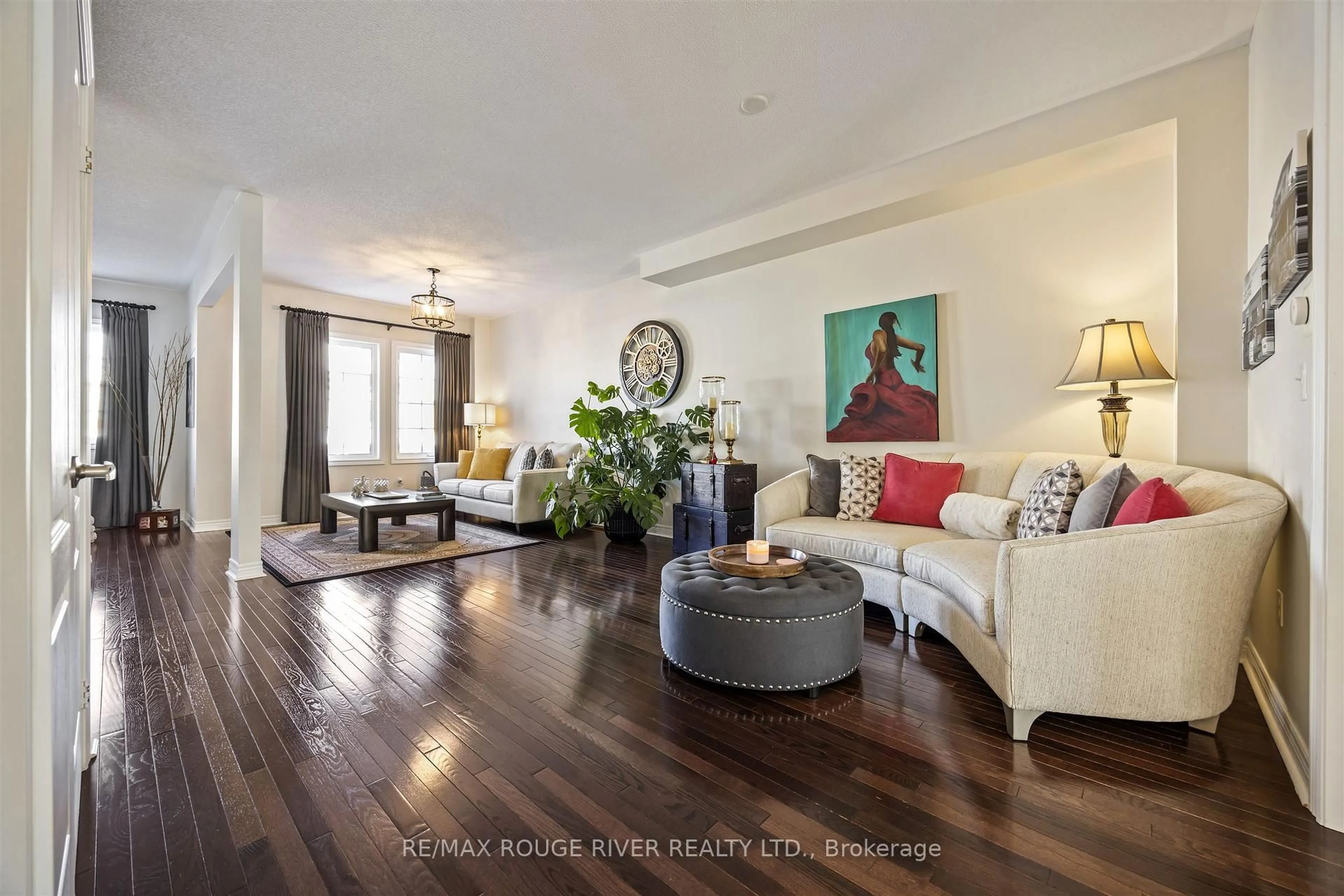 Living room with furniture, wood/laminate floor for 1721 Carousel Dr, Pickering Ontario L1X 0C1