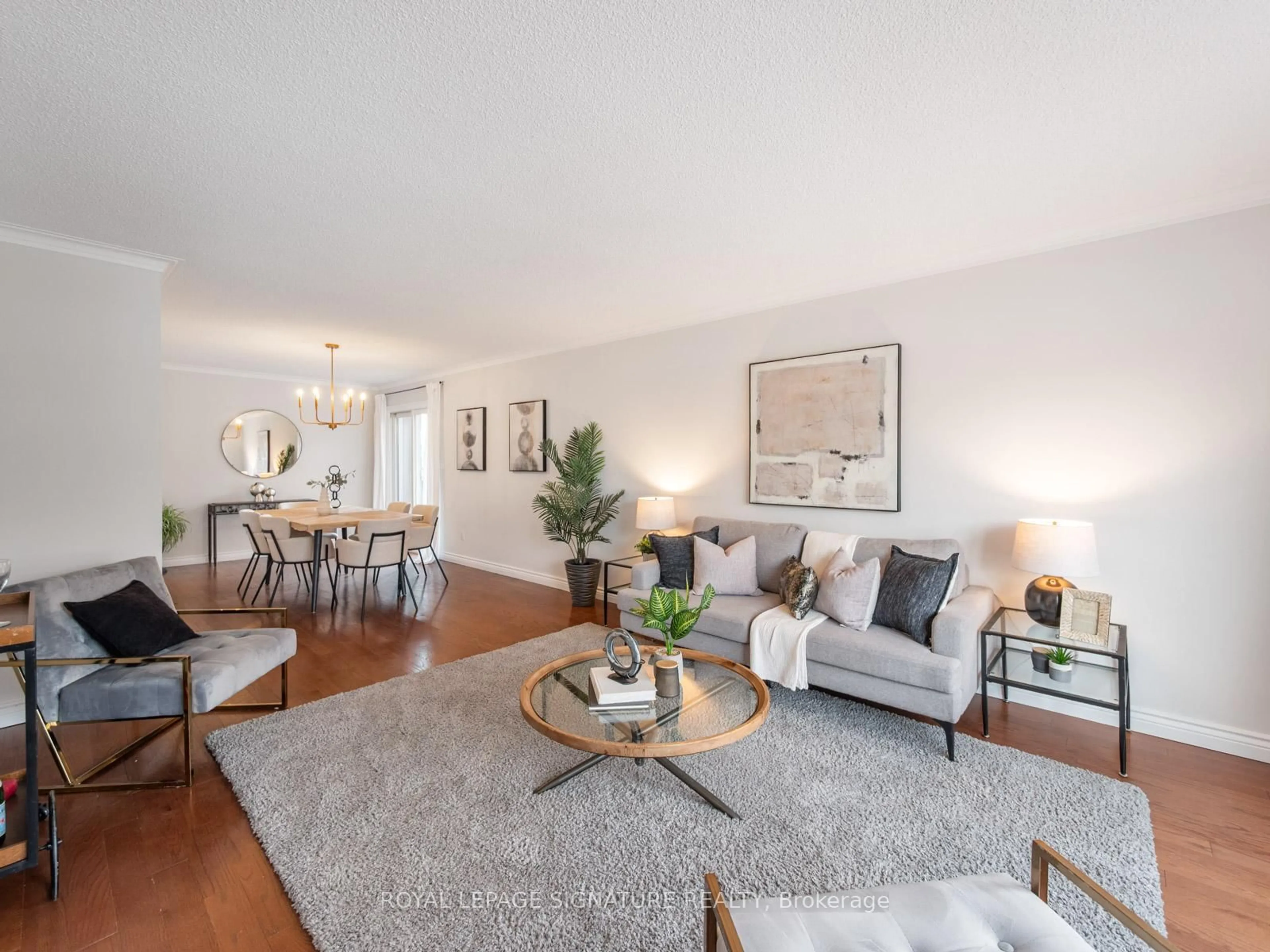 Living room with furniture, wood/laminate floor for 27 Mcculley St, Toronto Ontario M1C 2B2