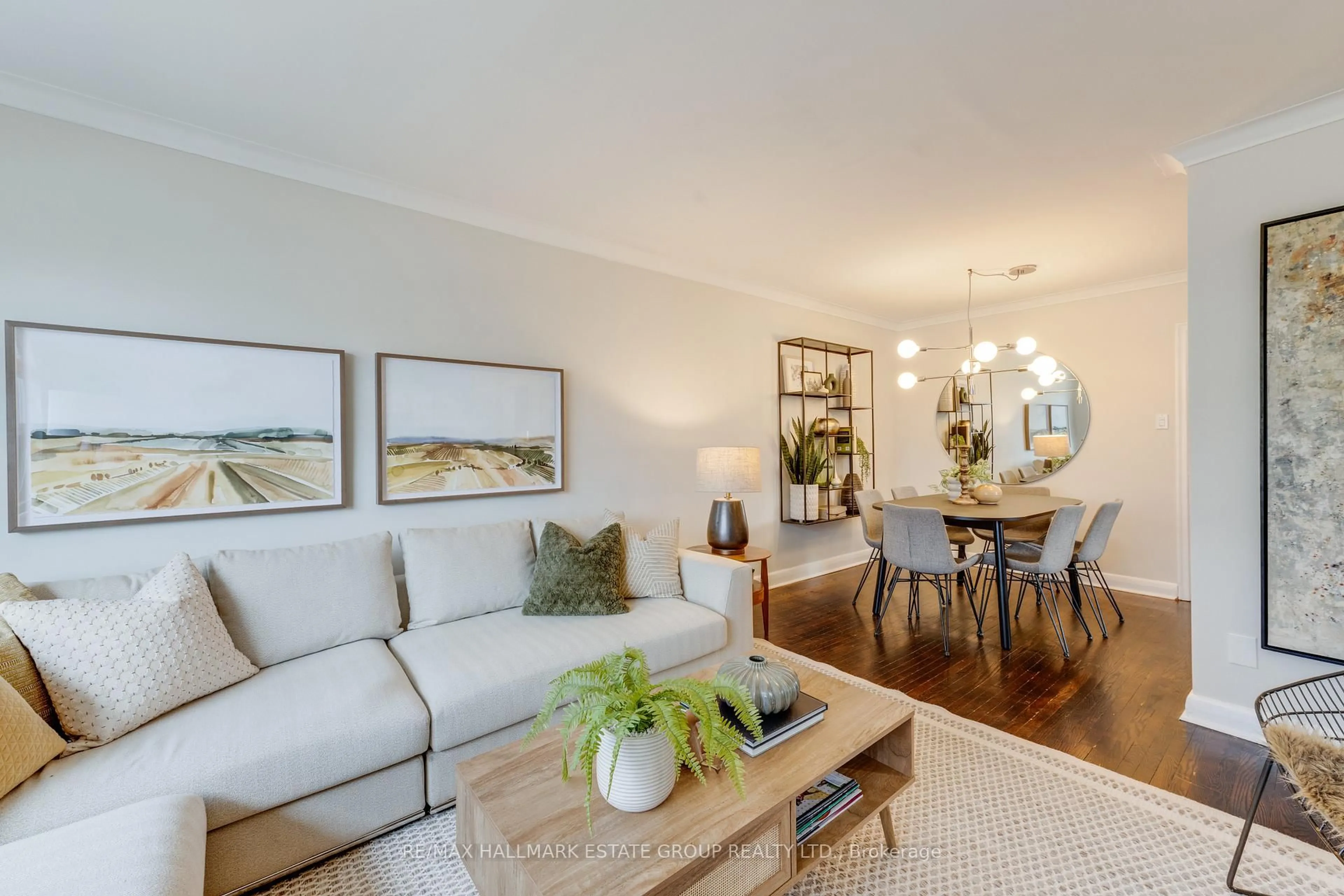 Living room with furniture, wood/laminate floor for 225 Woodville Ave, Toronto Ontario M4J 2R4