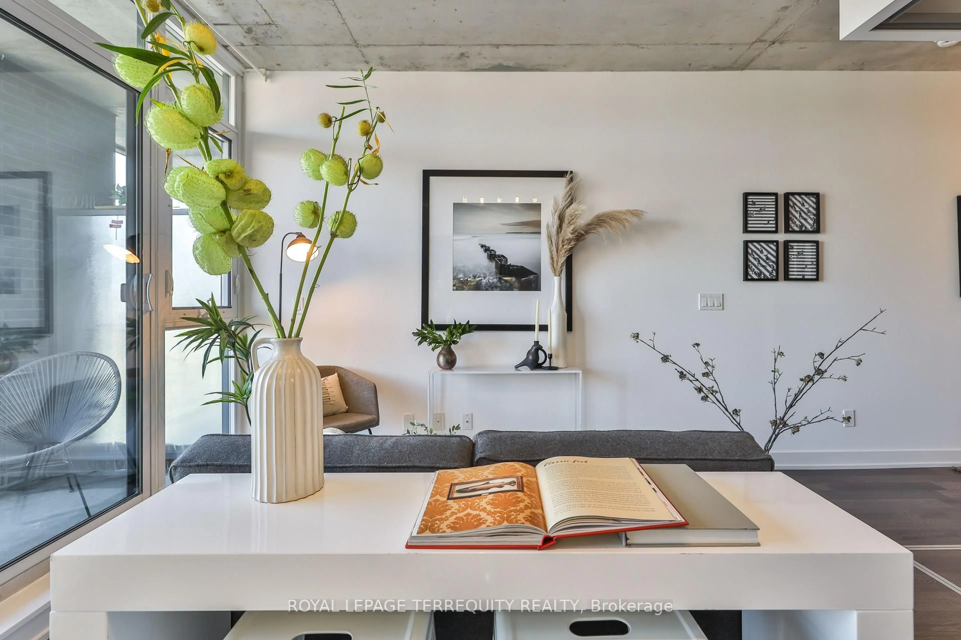 Living room with furniture, cement floor for 1190 Dundas St #625, Toronto Ontario M4M 0C5