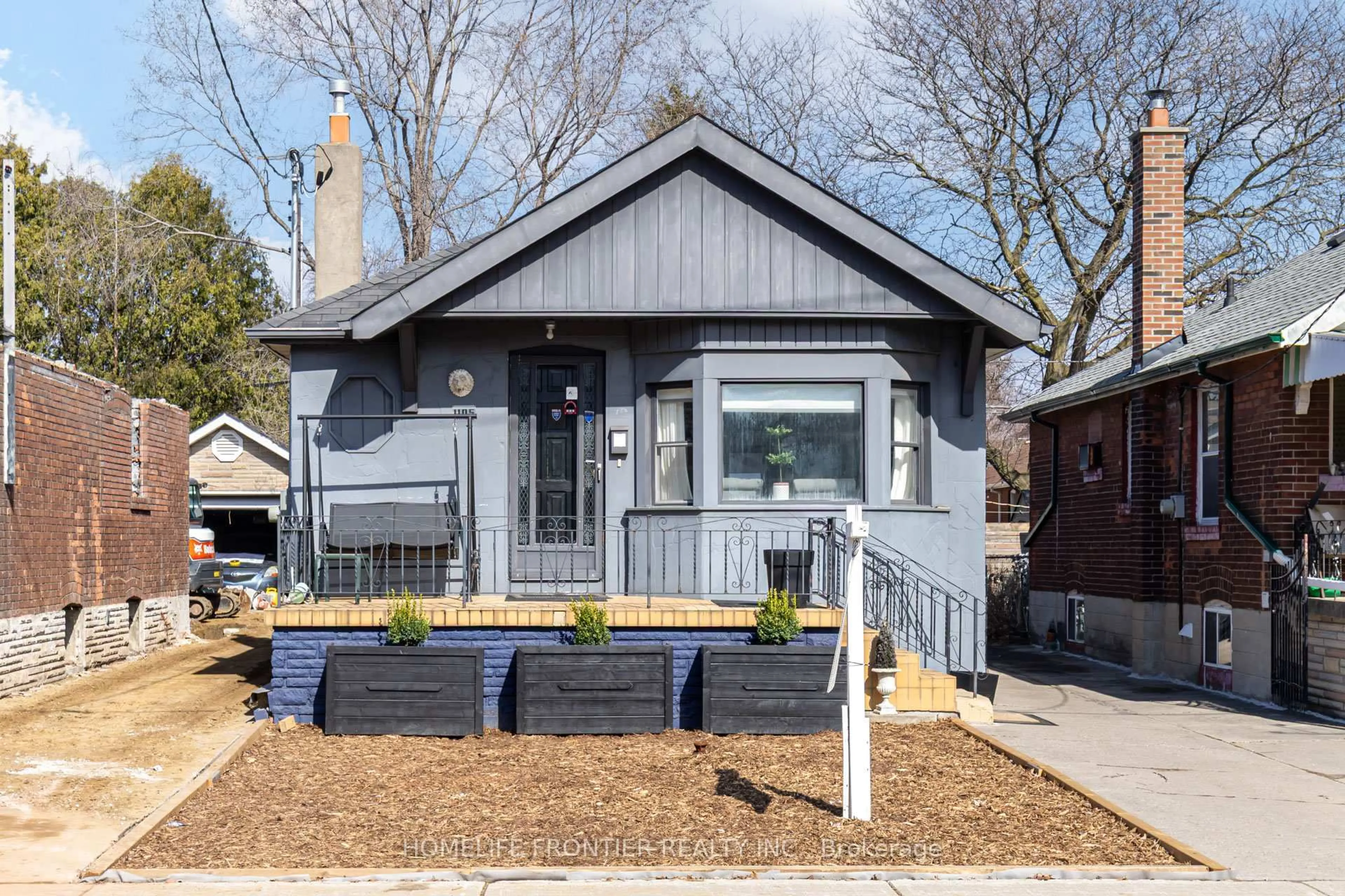 Home with vinyl exterior material, street for 1105 Greenwood Ave, Toronto Ontario M4J 4E5