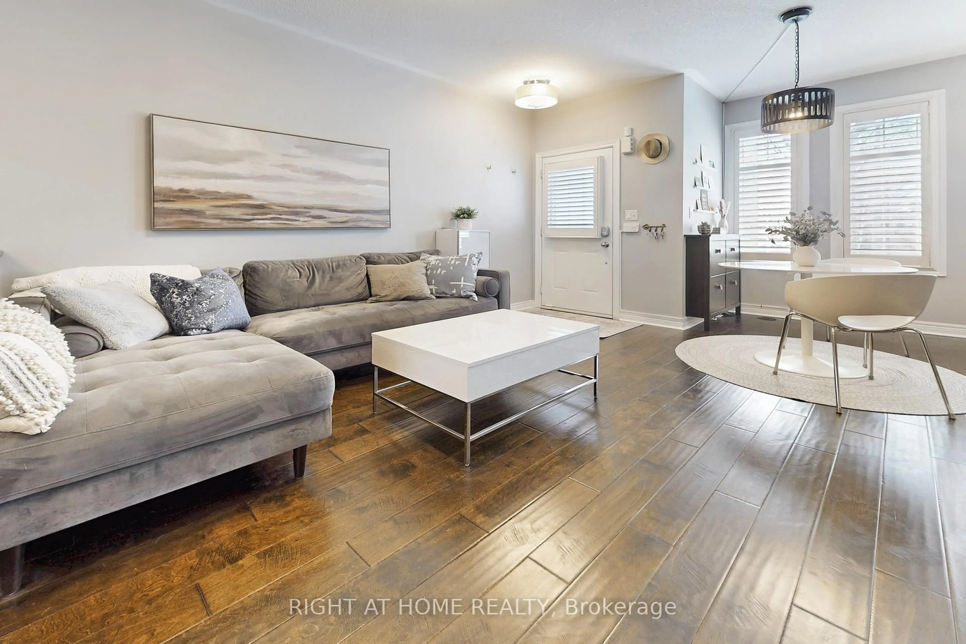 Living room with furniture, wood/laminate floor for 33 Brockville St, Toronto Ontario M4E 0A7