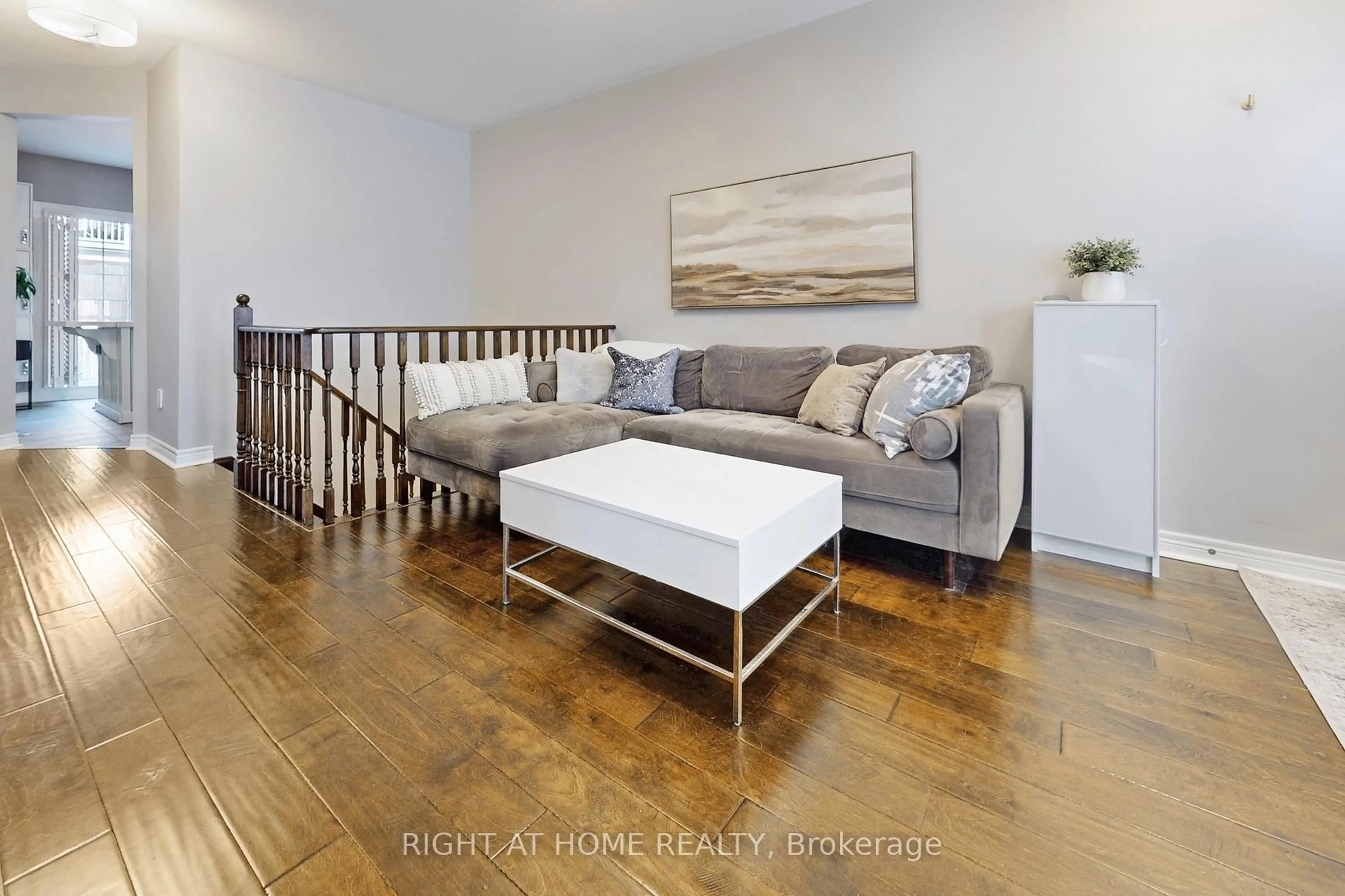 Living room with furniture, wood/laminate floor for 33 Brockville St, Toronto Ontario M4E 0A7