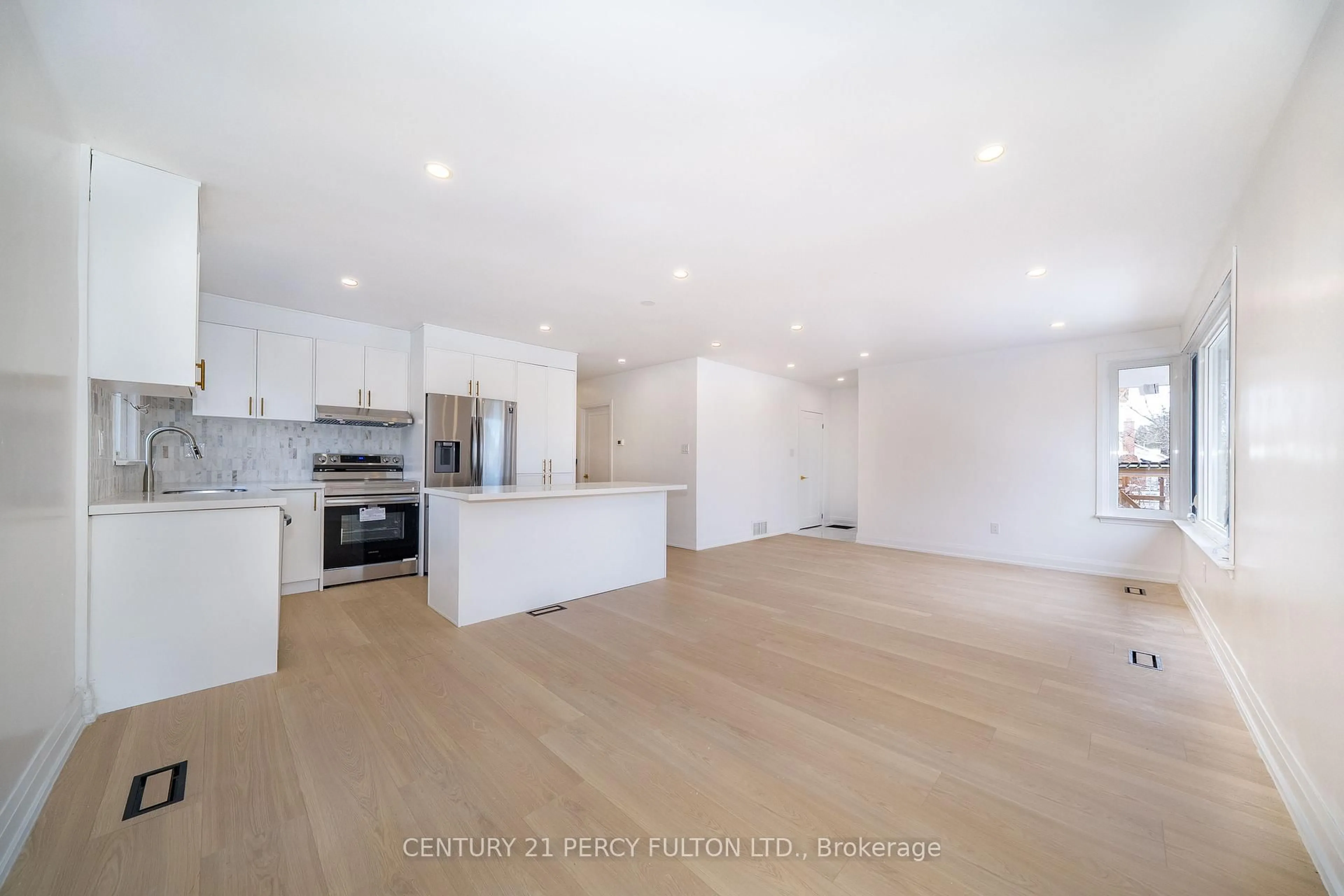 Open concept kitchen, wood/laminate floor for 49 Amiens Rd, Toronto Ontario M1E 3S7