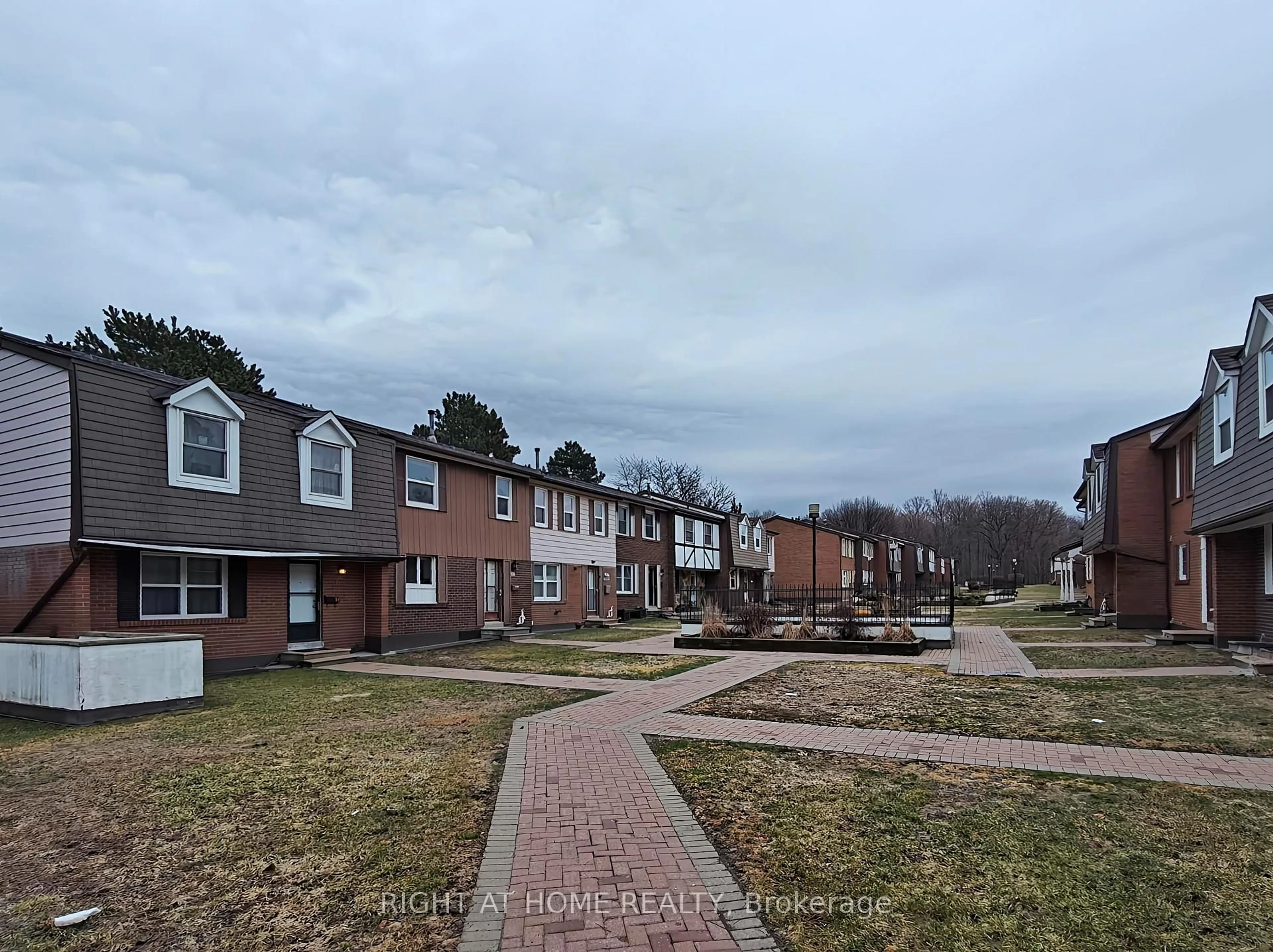 A pic from outside/outdoor area/front of a property/back of a property/a pic from drone, street for 15 Brimwood Blvd #61, Toronto Ontario M1V 1E1